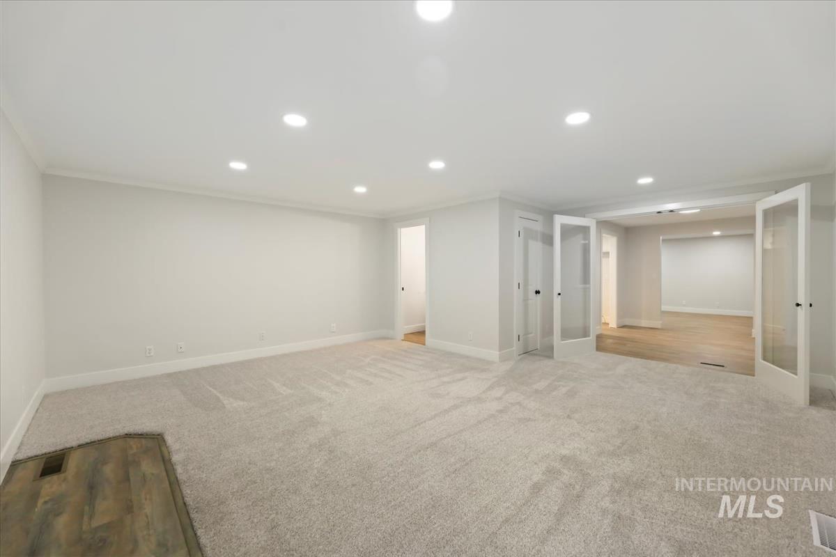 Finished basement featuring recessed lighting and carpet floors