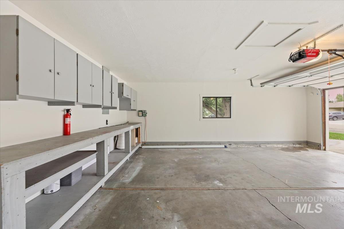 Garage featuring a garage door opener