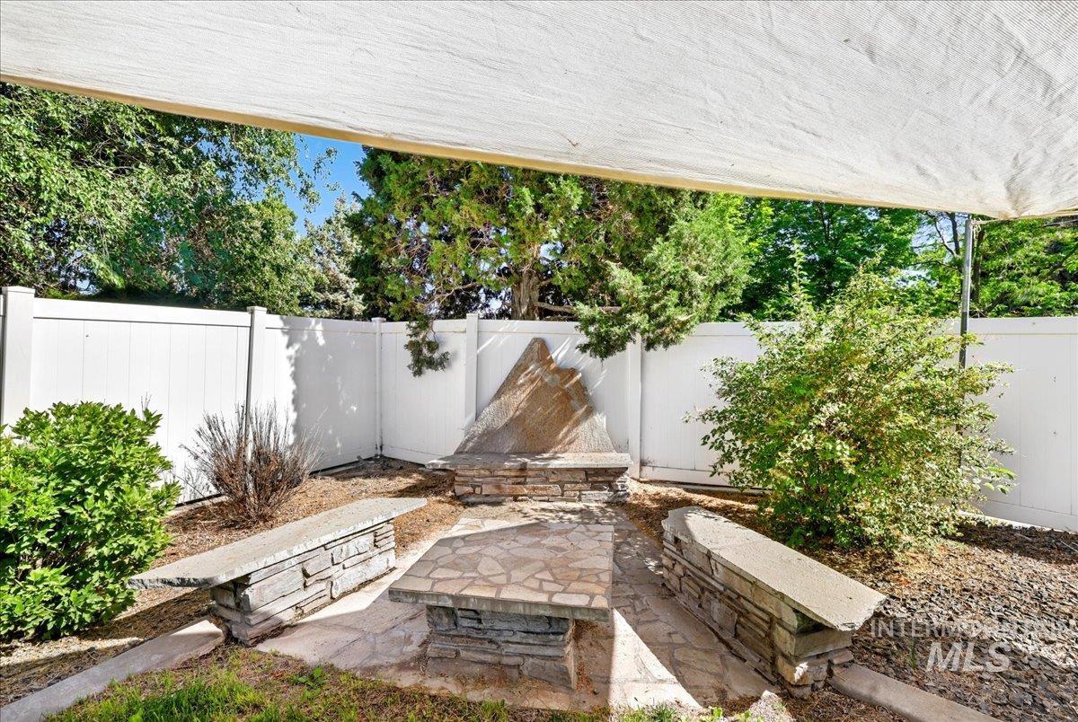 Fenced backyard with a patio area