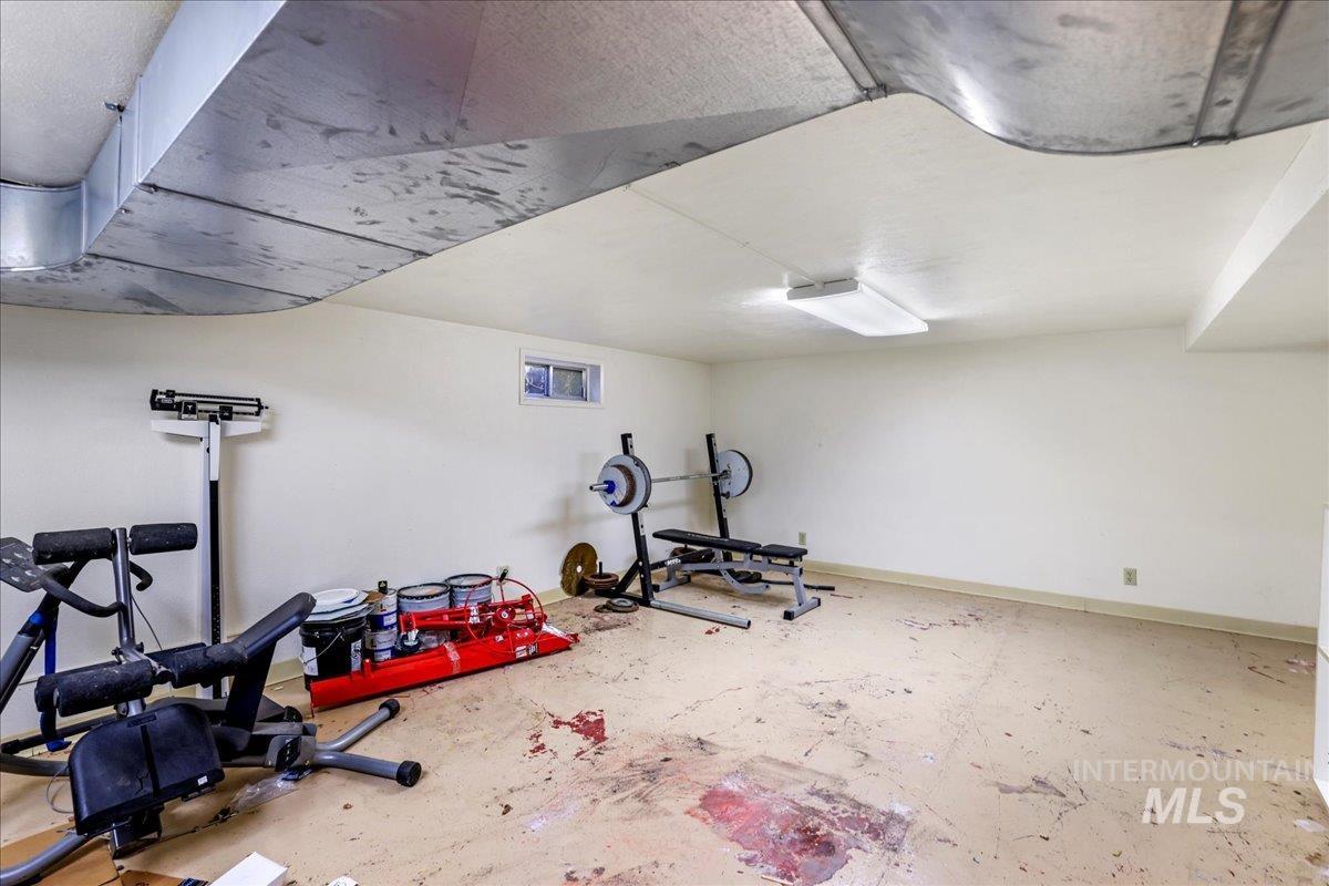 Workout area featuring baseboards