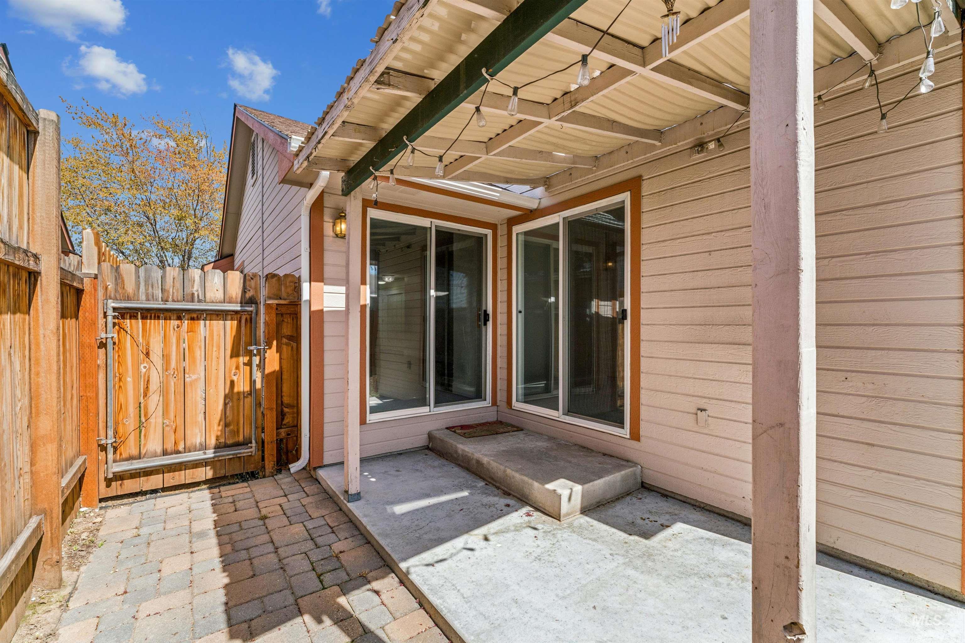 View of patio with a gate