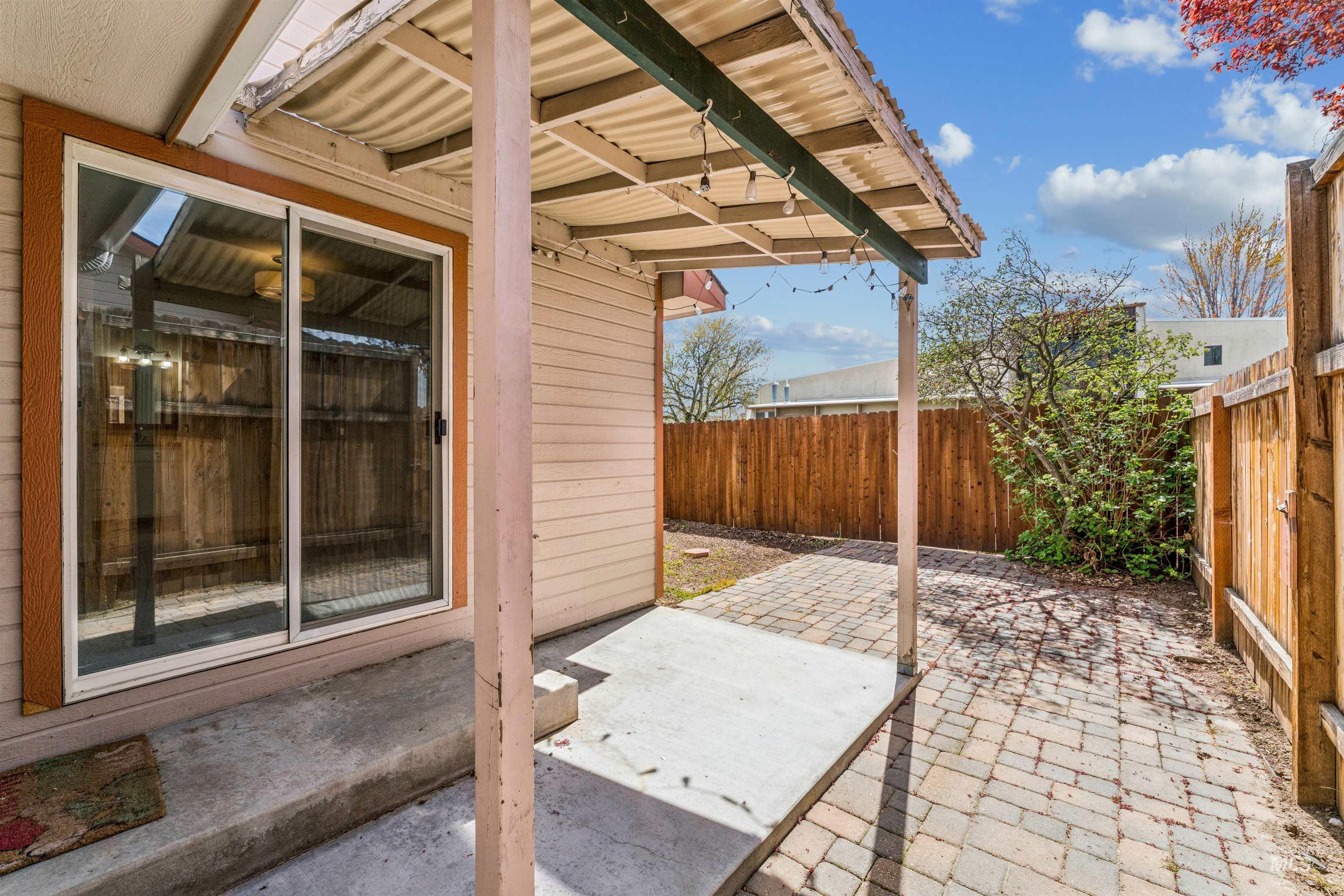 Fenced backyard featuring a patio area