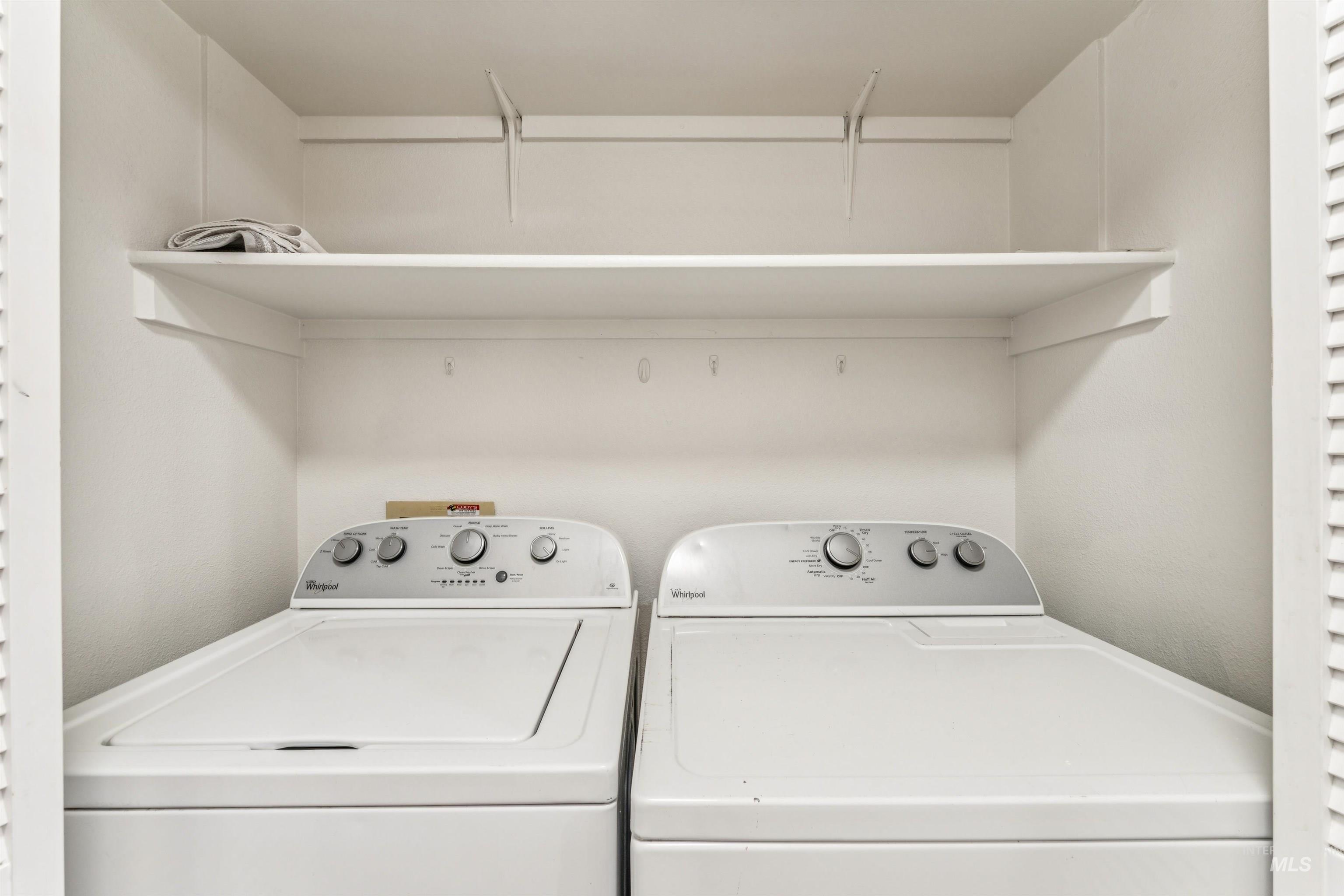 Laundry area with washing machine and clothes dryer