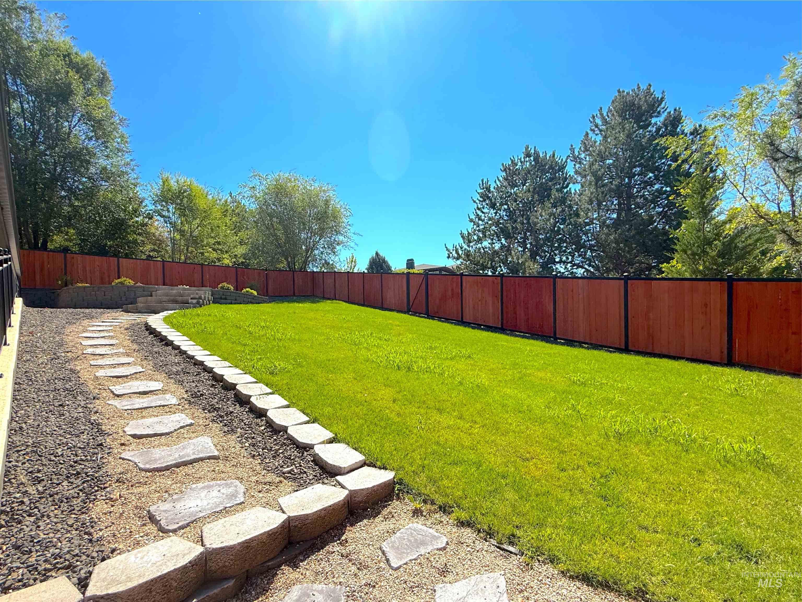 View of fenced backyard