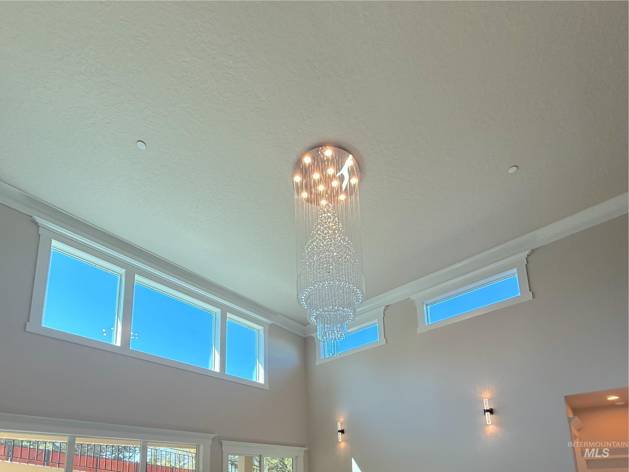 Detailed view of a chandelier and ornamental molding