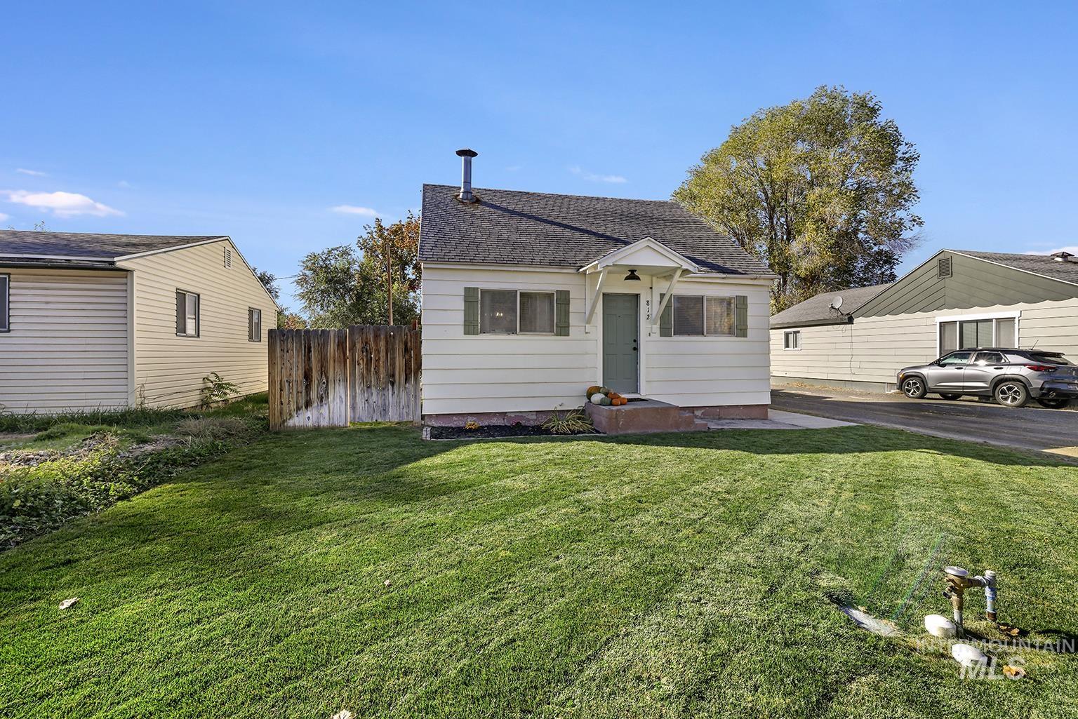 View of front of home featuring a shingled roof