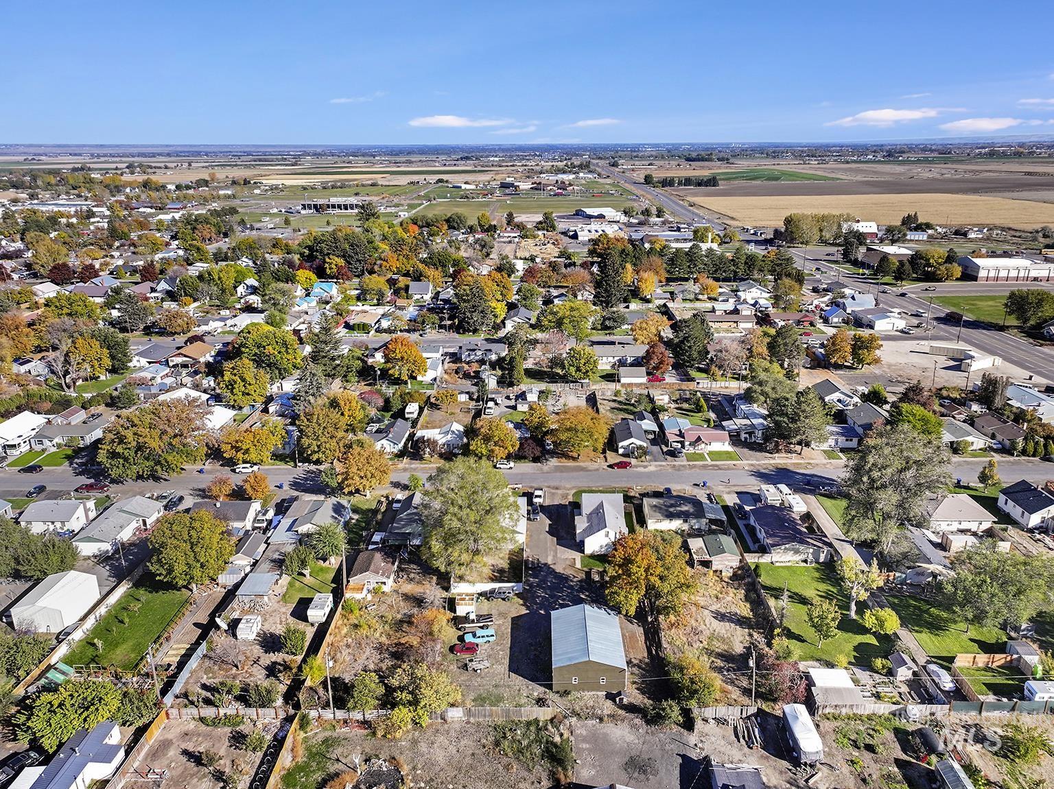 Aerial overview of property's location with nearby suburban area