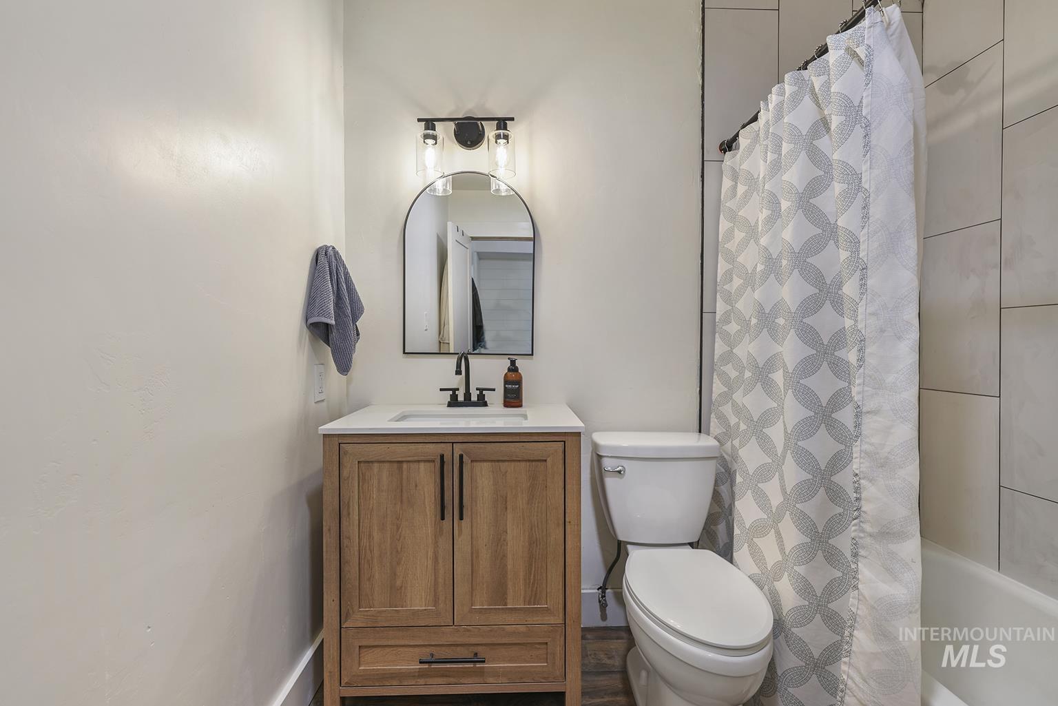 Full bathroom featuring vanity and shower / tub combo
