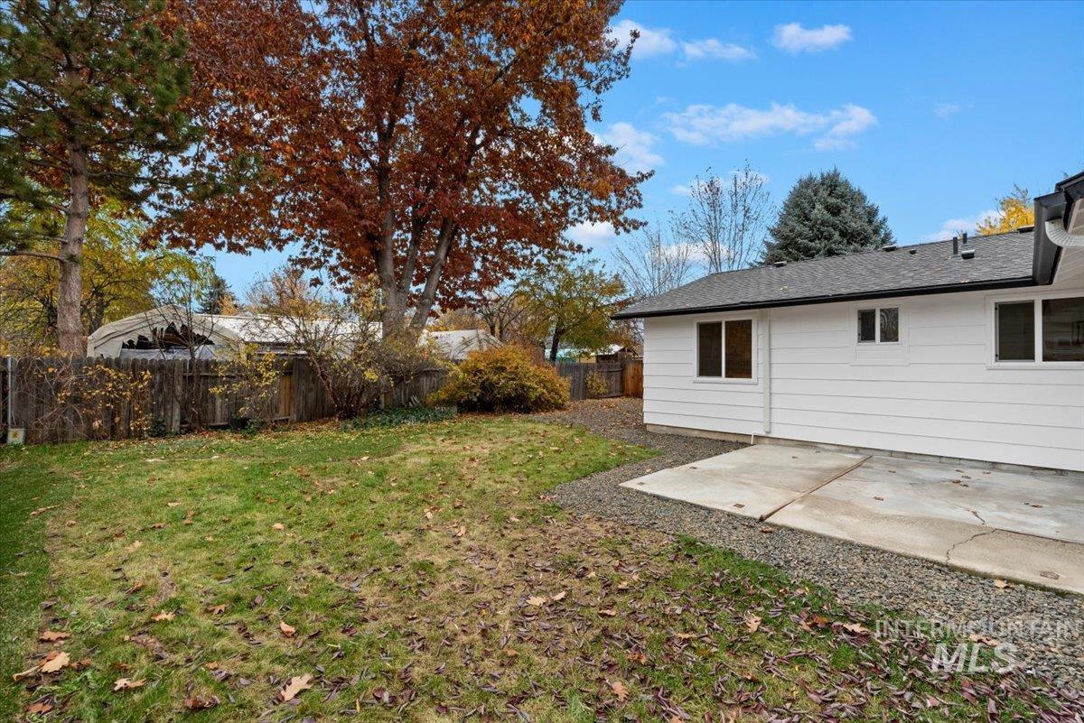 Fenced backyard with a patio area