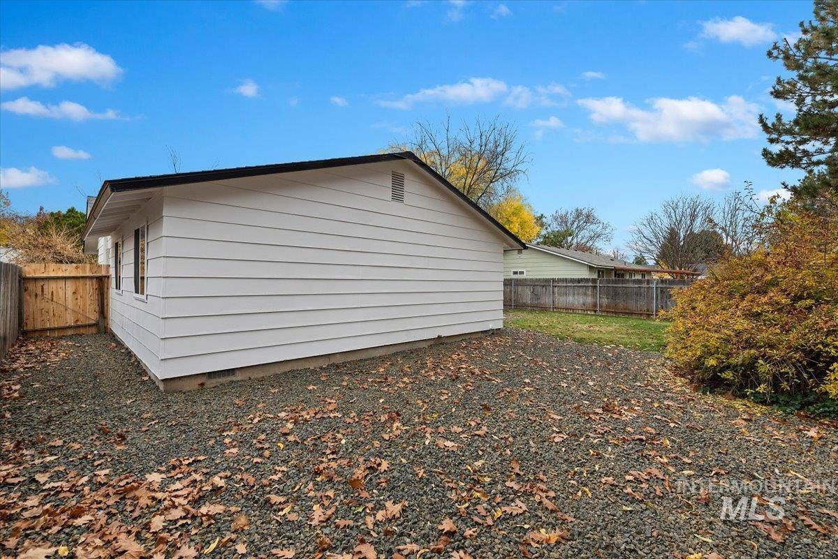 View of property exterior with a fenced backyard