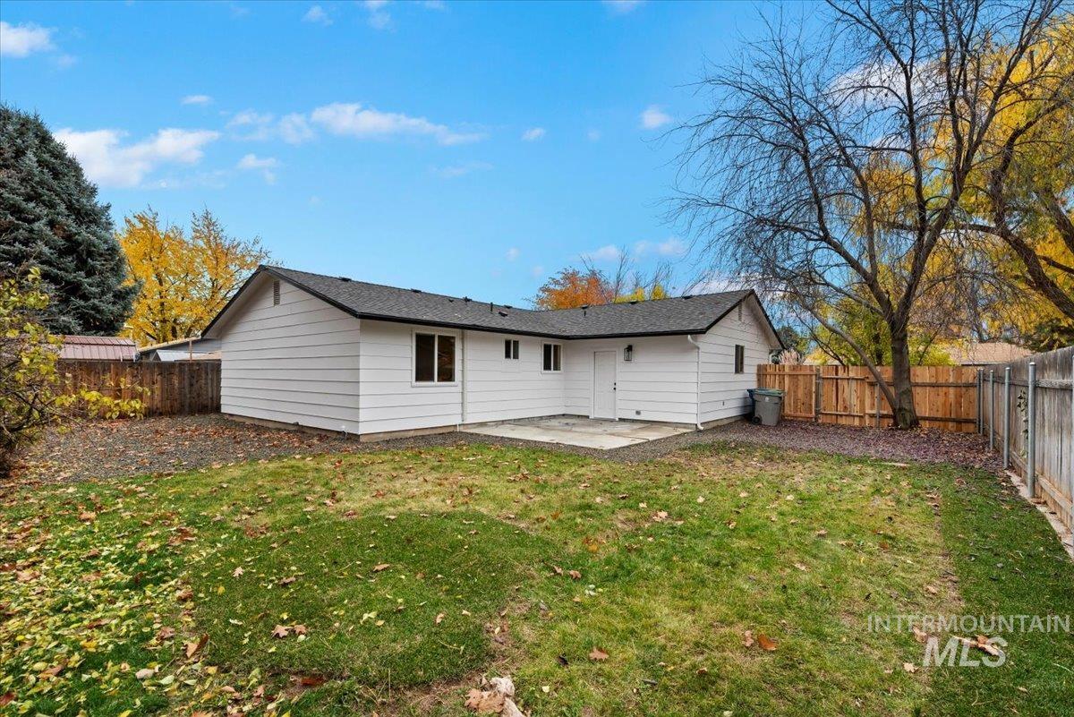 Rear view of property with a patio area and a fenced backyard