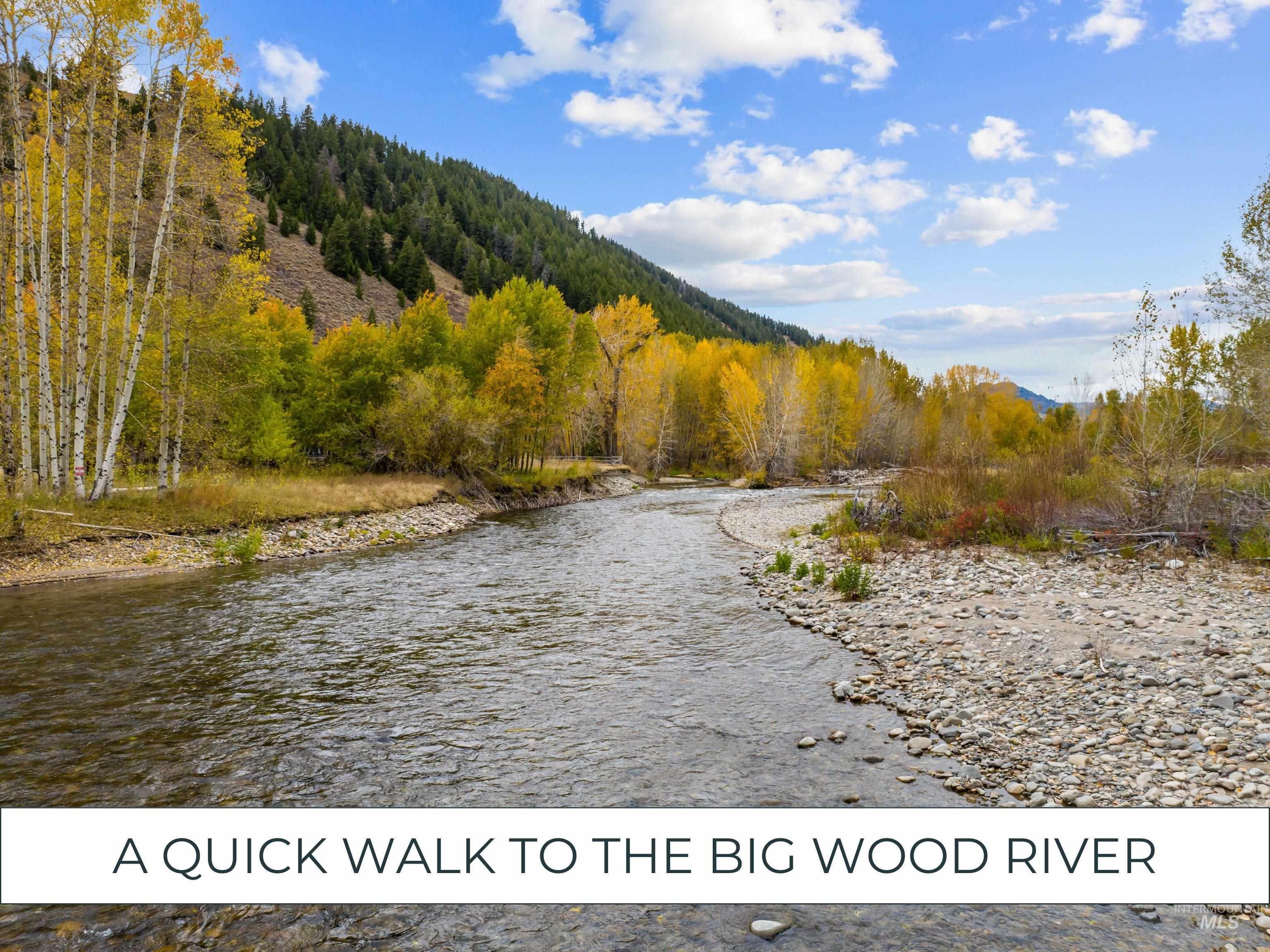 Water view with a heavily wooded area and mountains