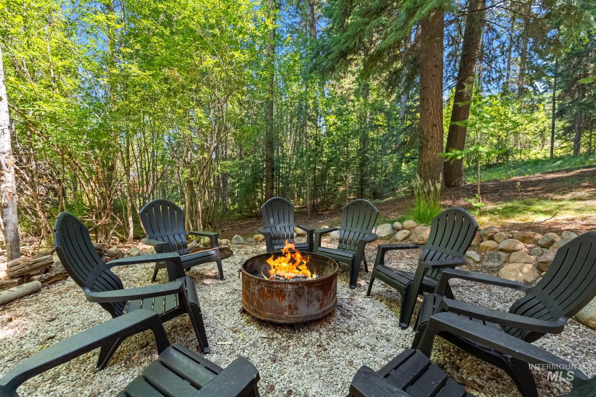View of patio featuring an outdoor fire pit