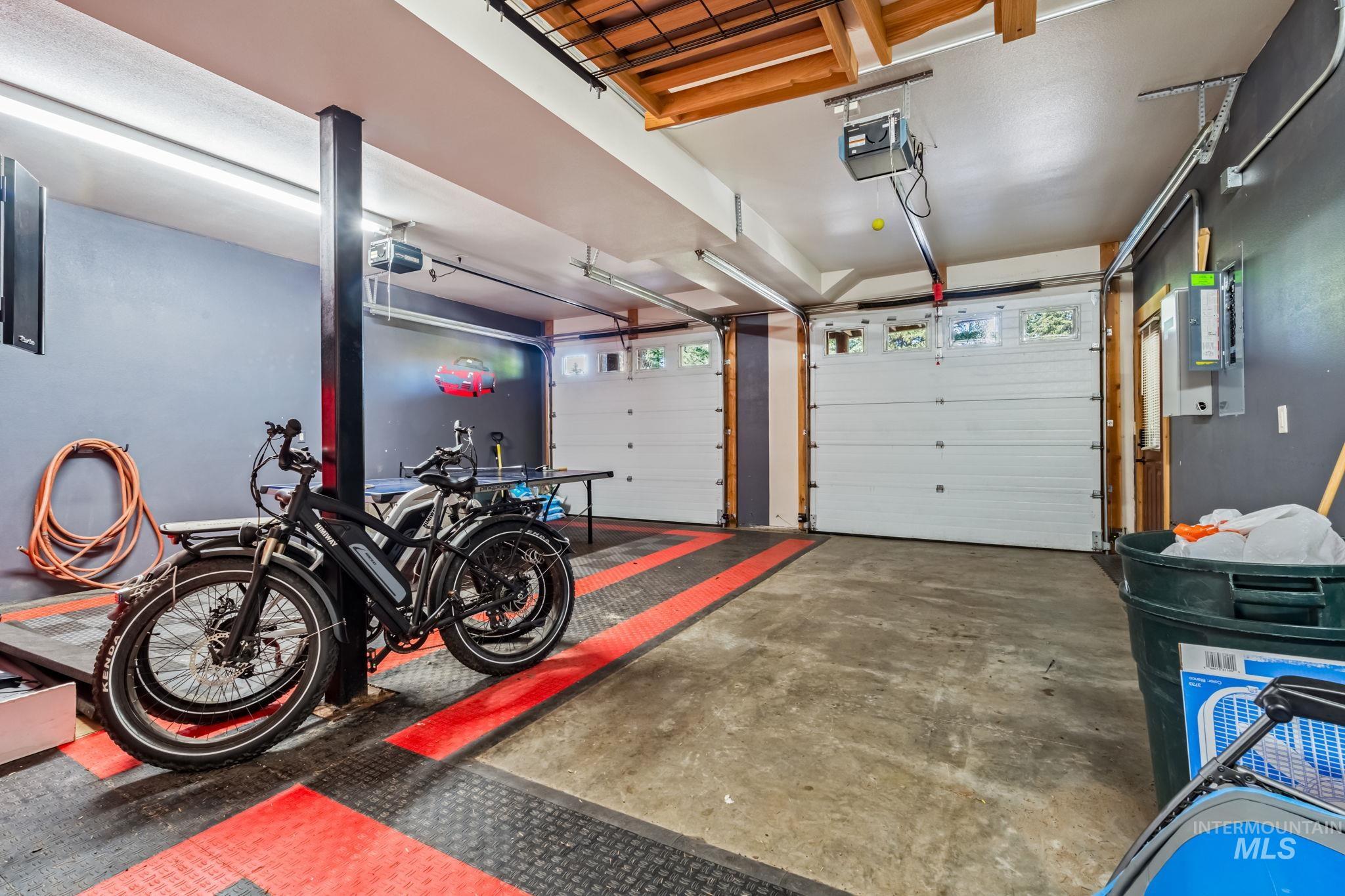 Garage featuring a garage door opener