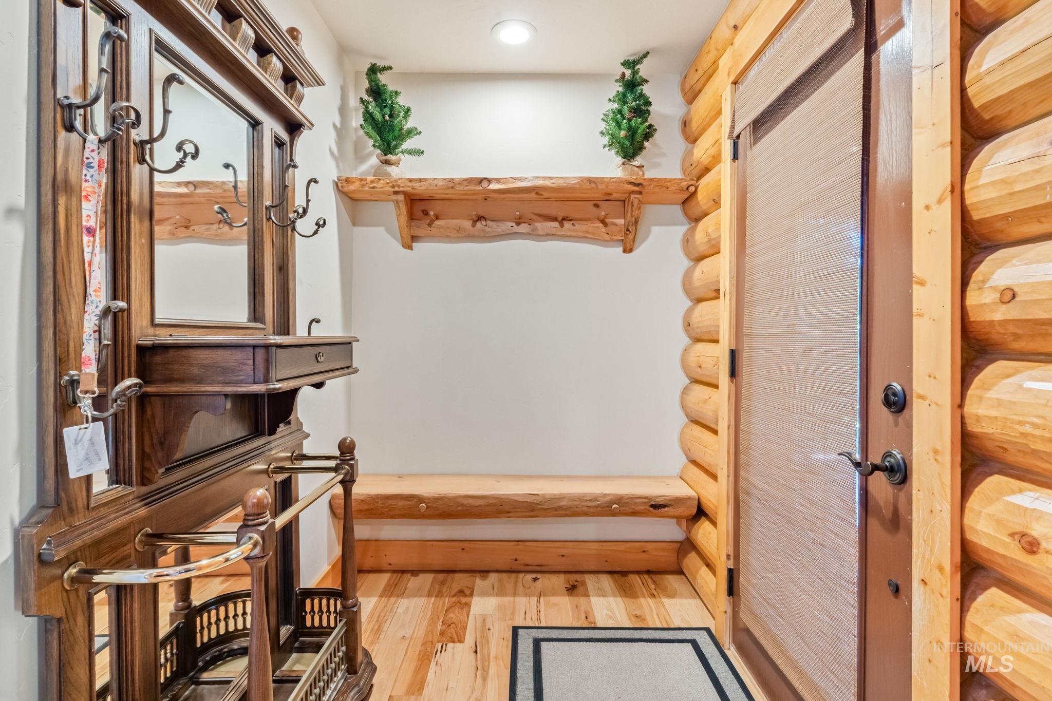 Mudroom featuring light wood-style floors