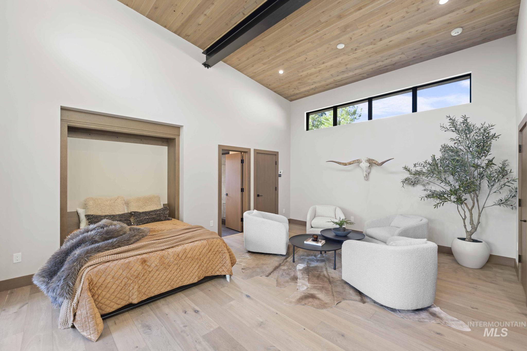 Bedroom featuring high vaulted ceiling, wood finished floors, a wood ceiling with exposed beams, and recessed lighting