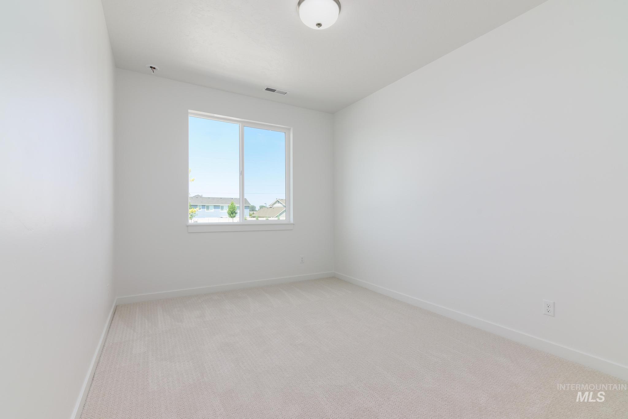 Spare room with light carpet