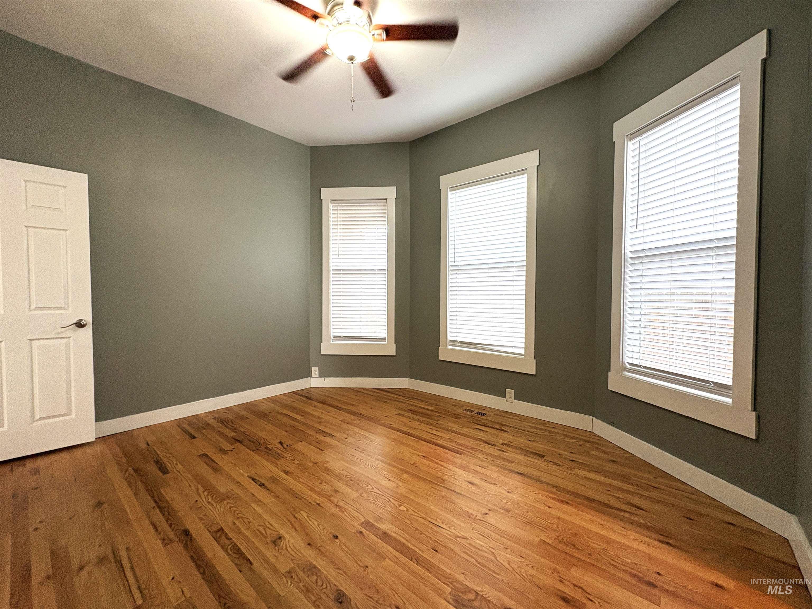 Main level master bedroom with ceiling fan.