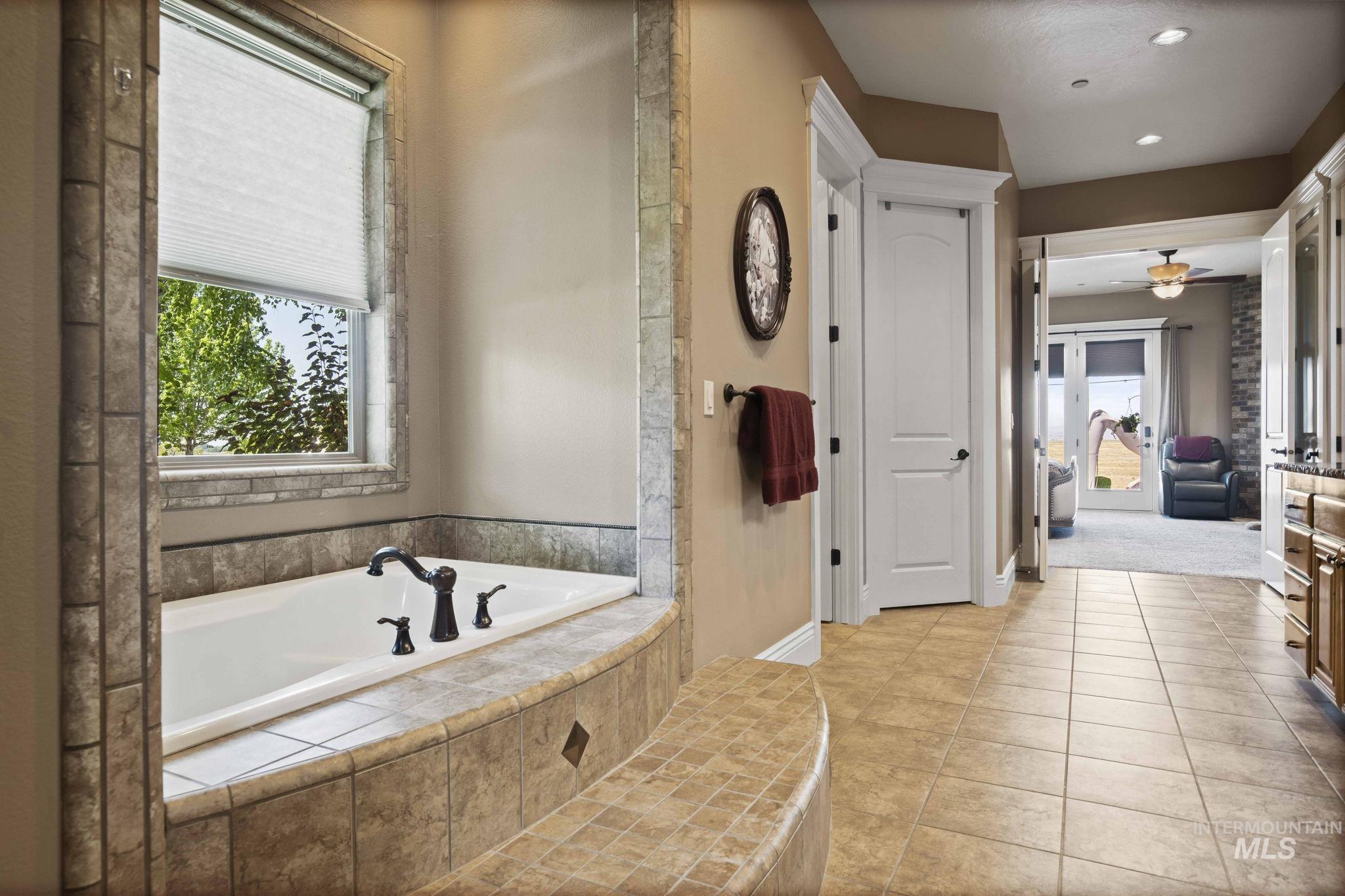 Full bath featuring a garden tub, tile patterned flooring, recessed lighting, and ceiling fan