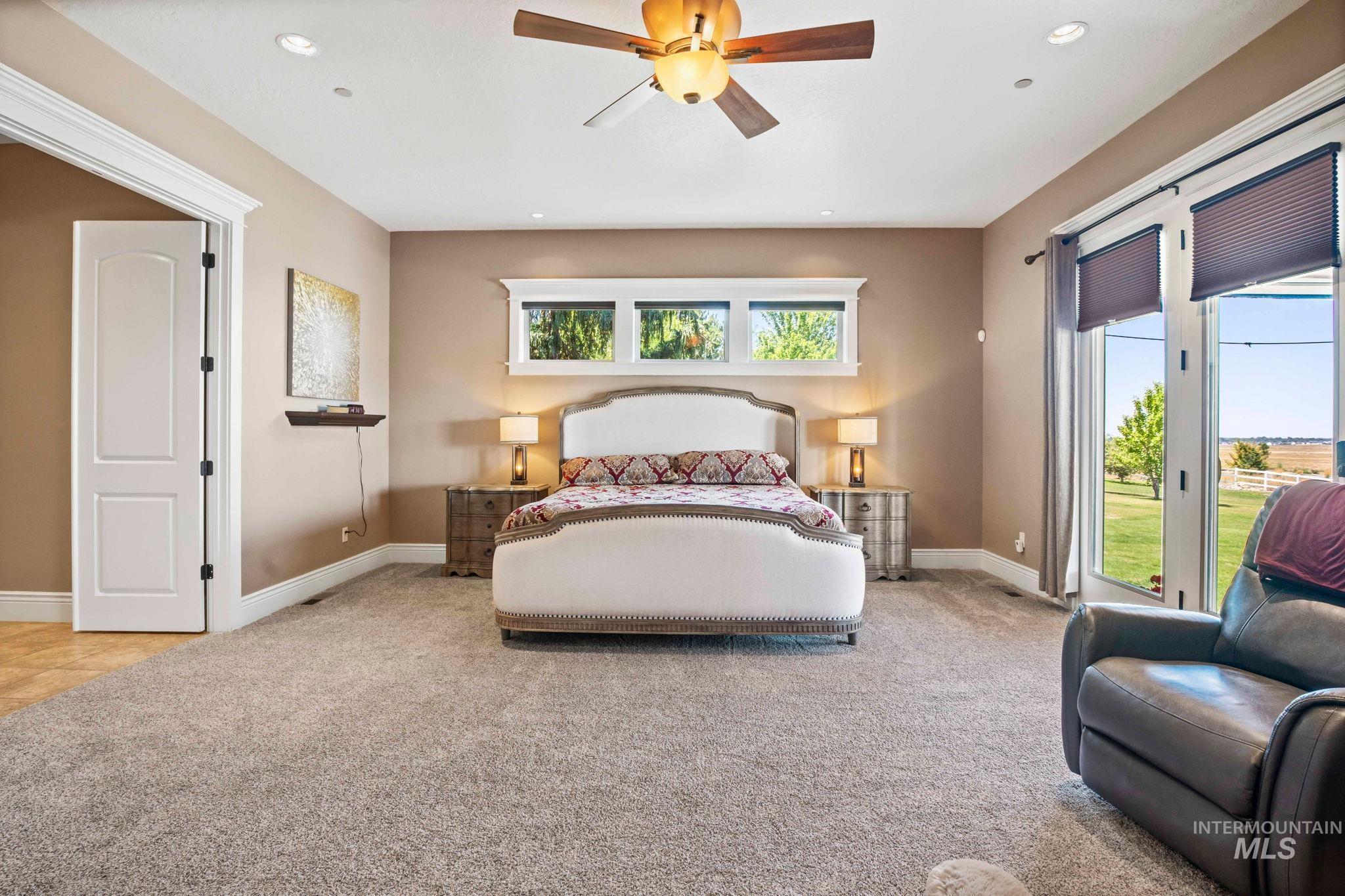 Carpeted bedroom with access to outside and recessed lighting