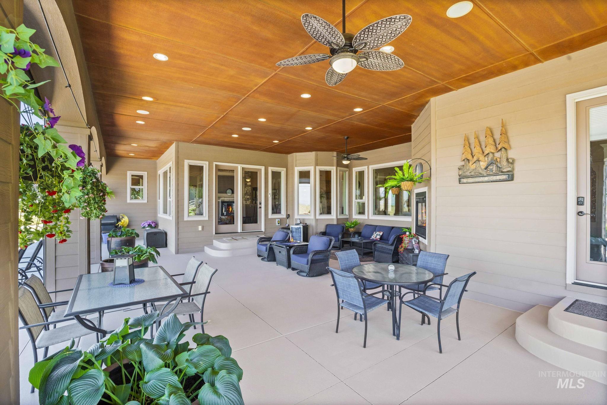 View of patio / terrace with outdoor dining space and ceiling fan