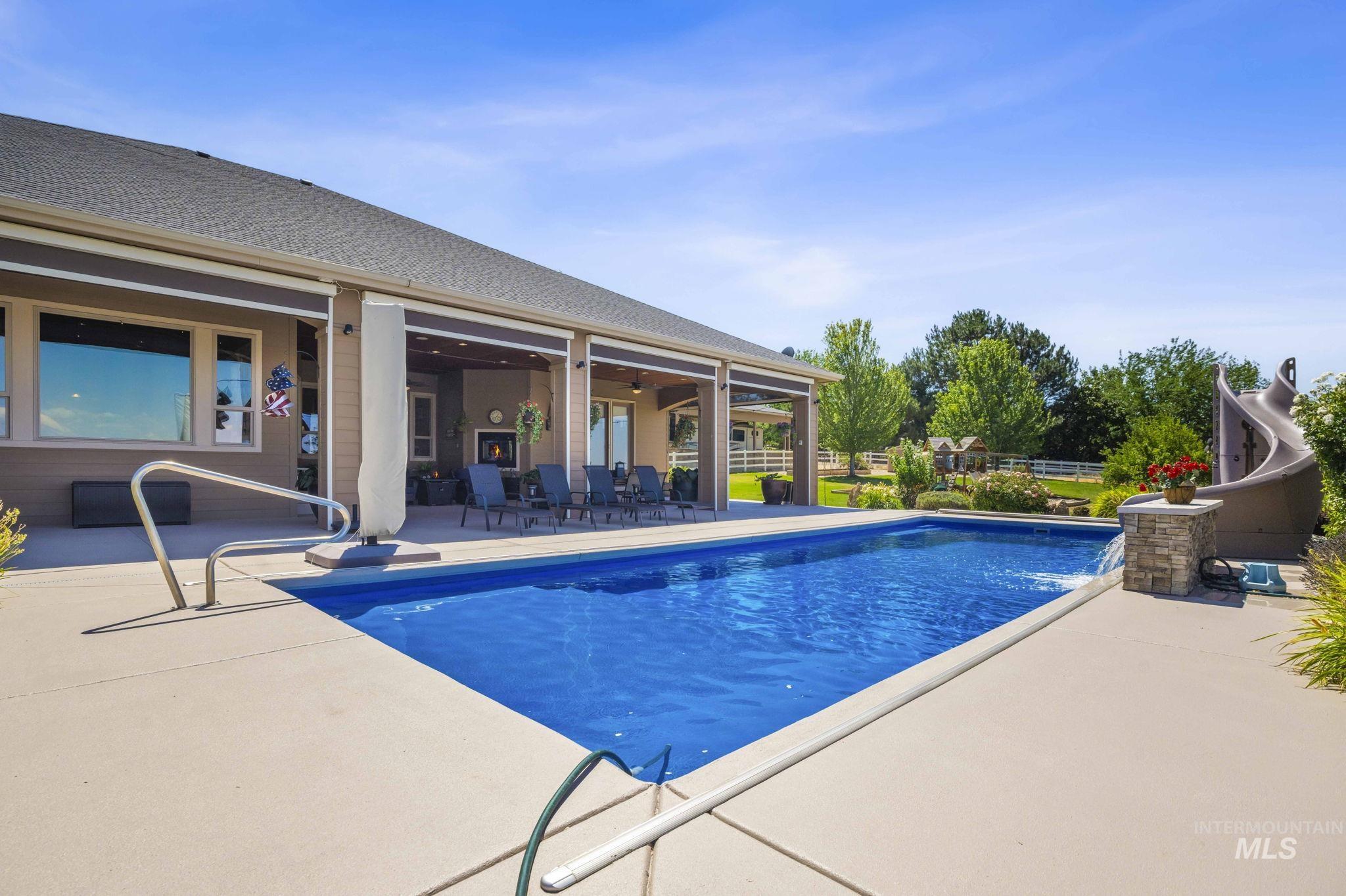 Outdoor pool featuring a patio