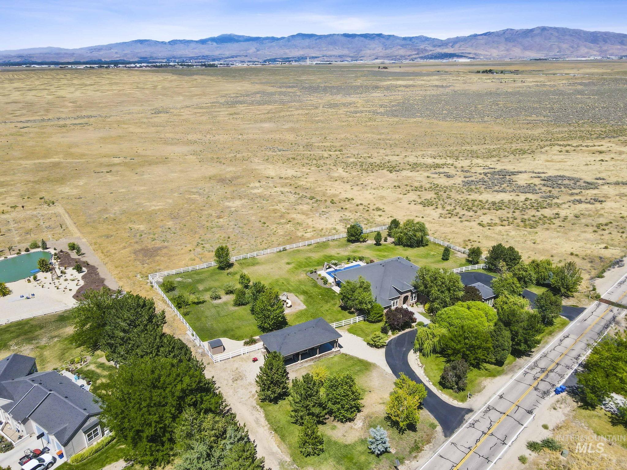 Aerial view of sparsely populated area featuring a mountainous background