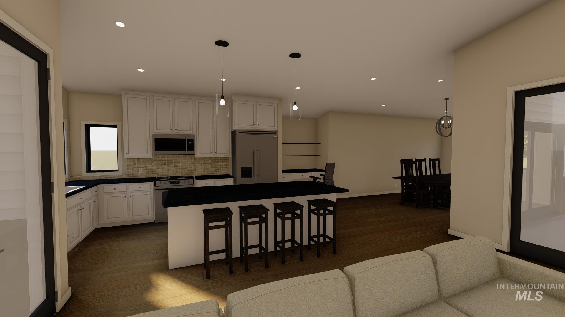 Kitchen featuring granite countertops, custom cabinetry, and pantry