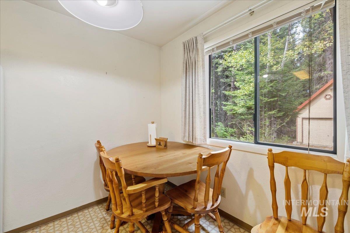 Dining space with plenty of natural light and light flooring