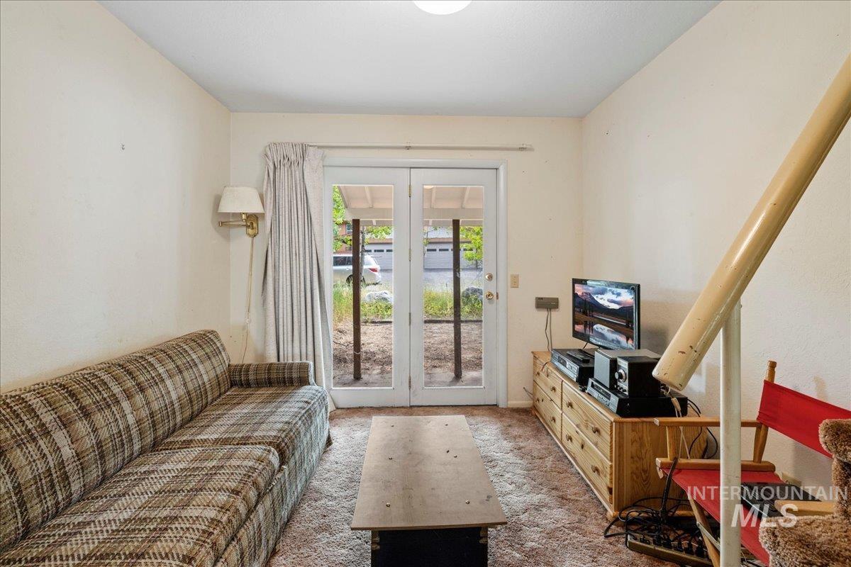 Sitting room featuring carpet floors