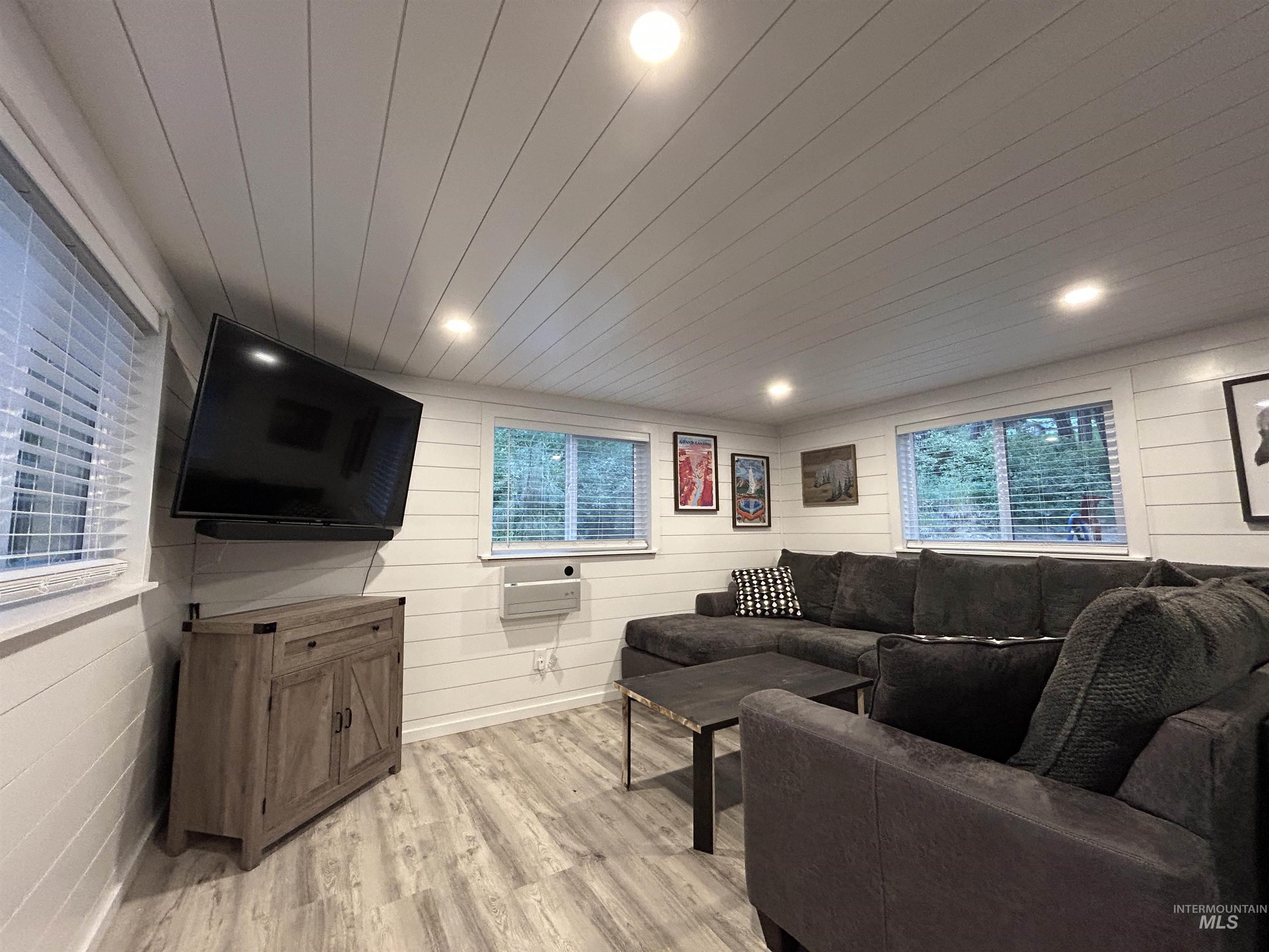 Living room featuring light wood-style flooring