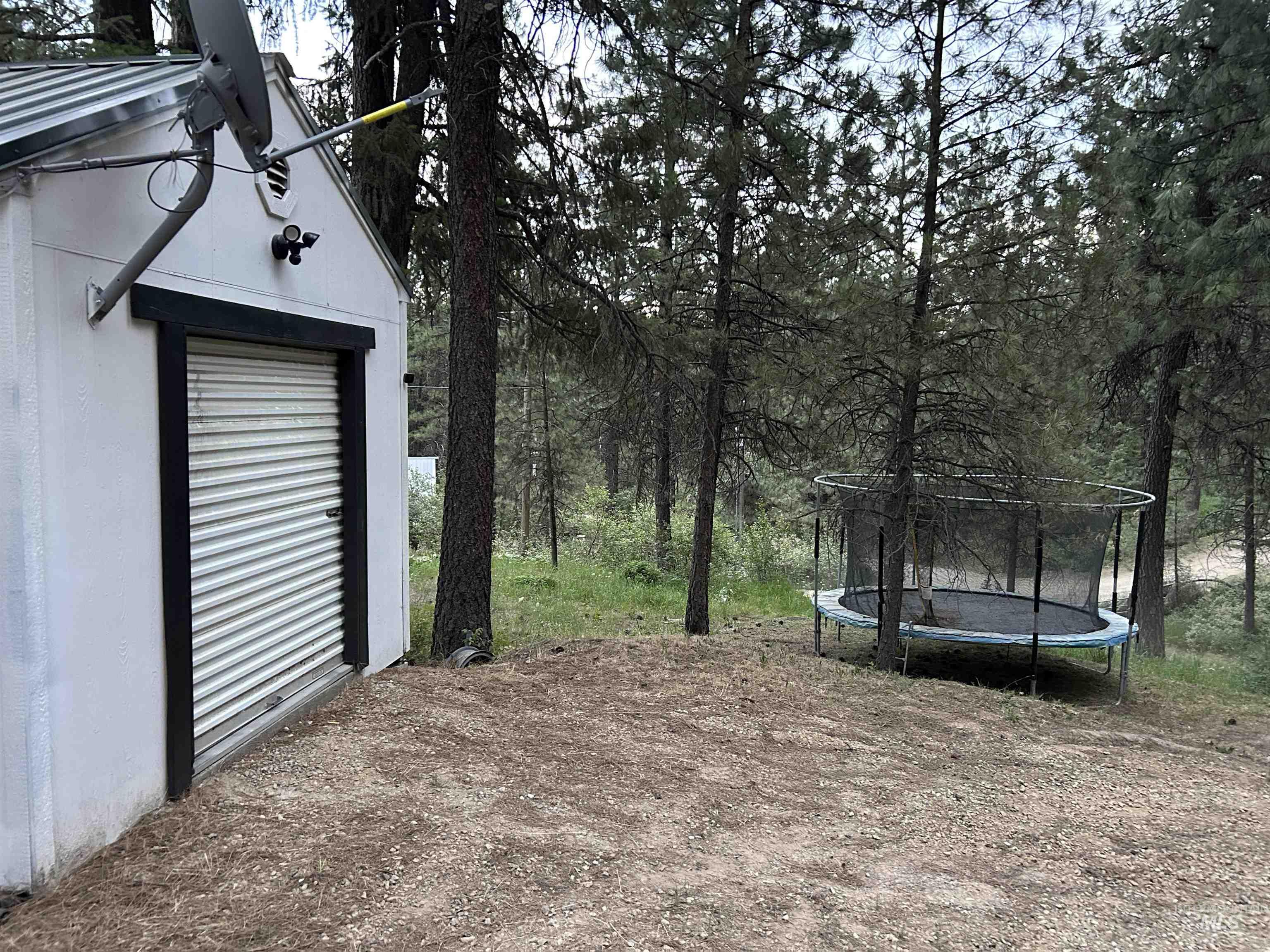View of yard featuring a trampoline