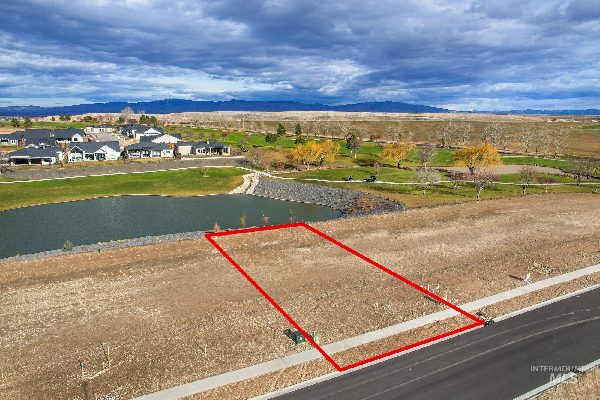 View of property location with property parcel outlined and a water and mountain view