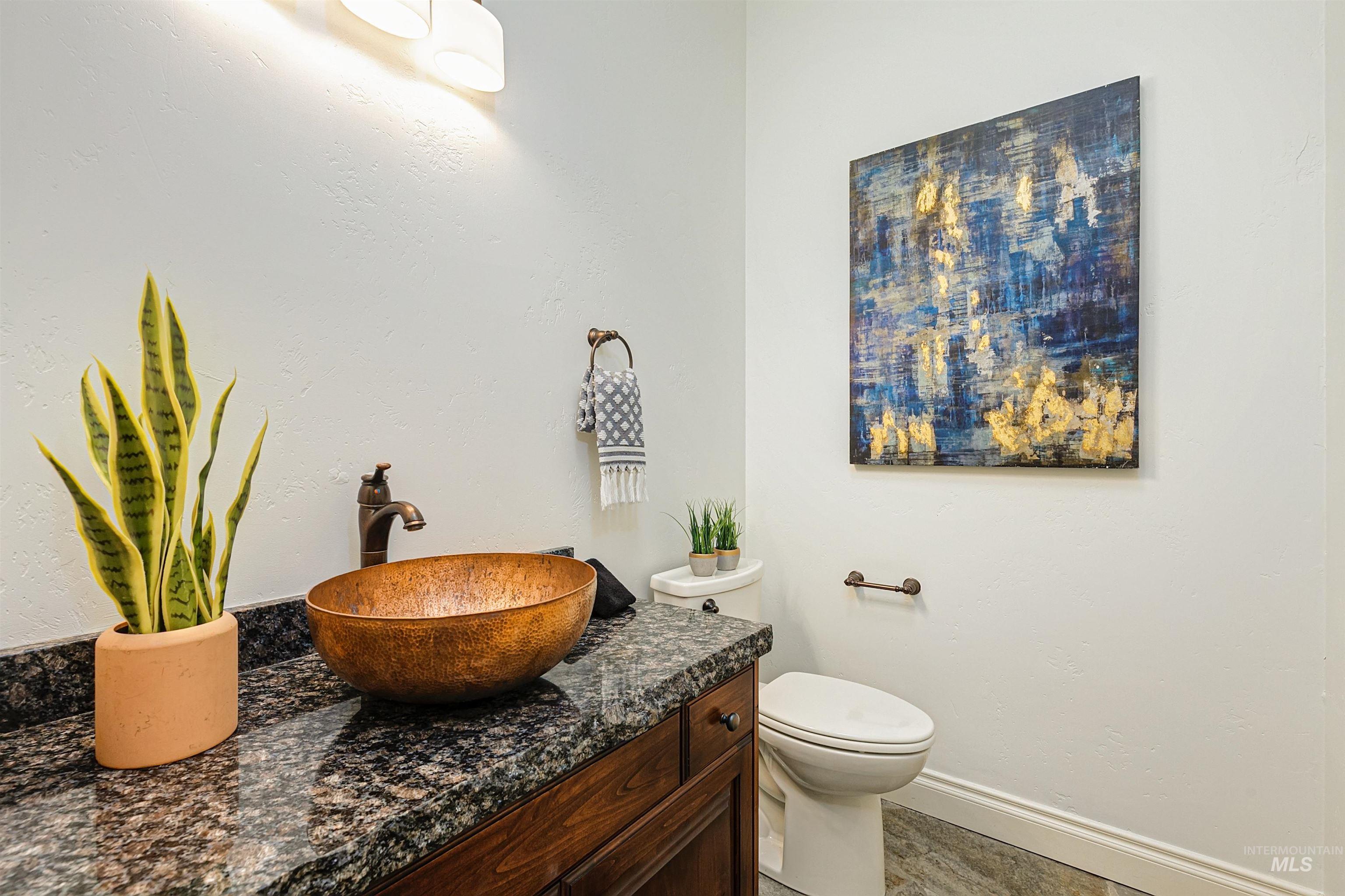 Bathroom featuring baseboards and vanity