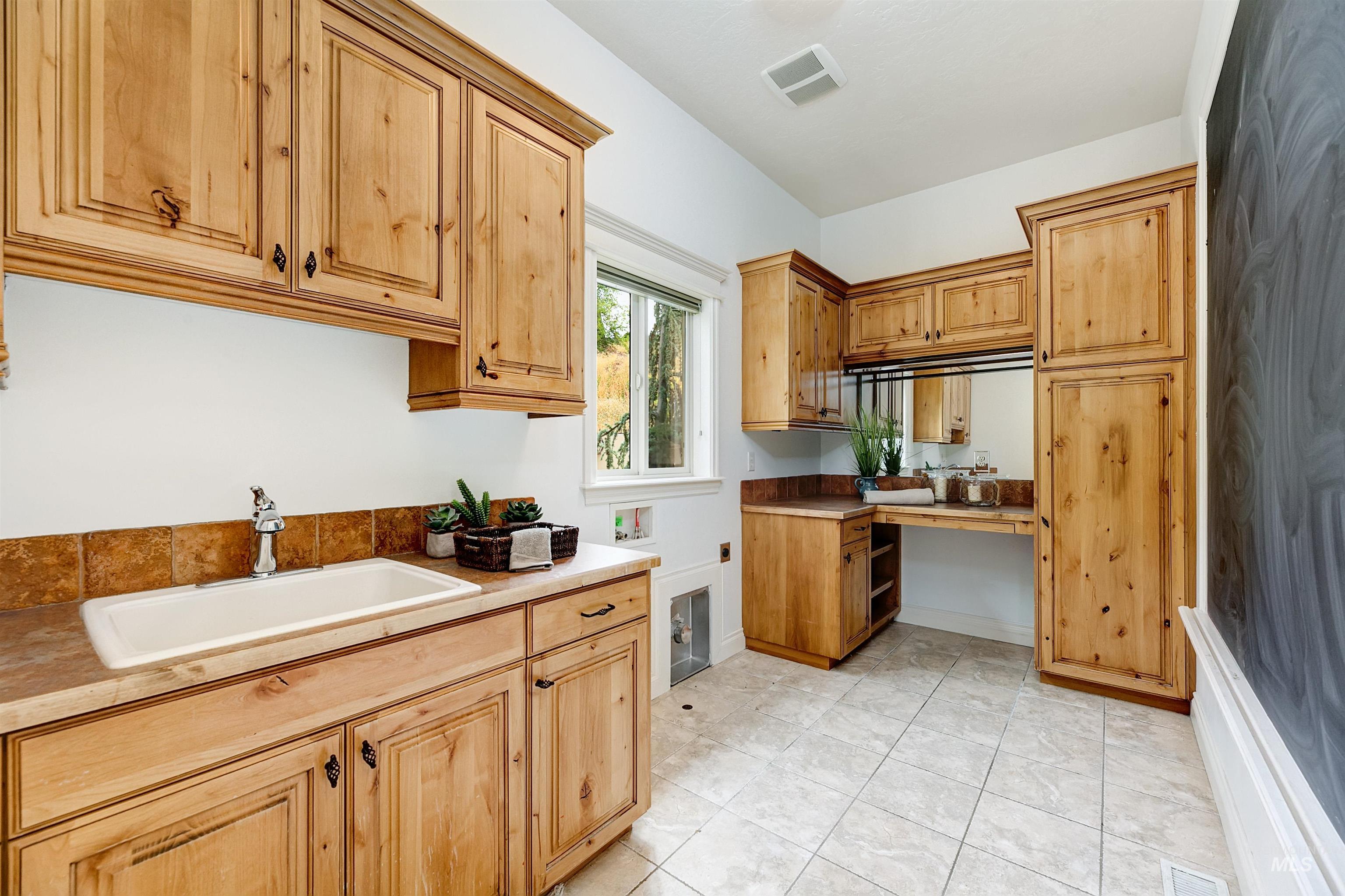 Kitchen with a sink and light countertops