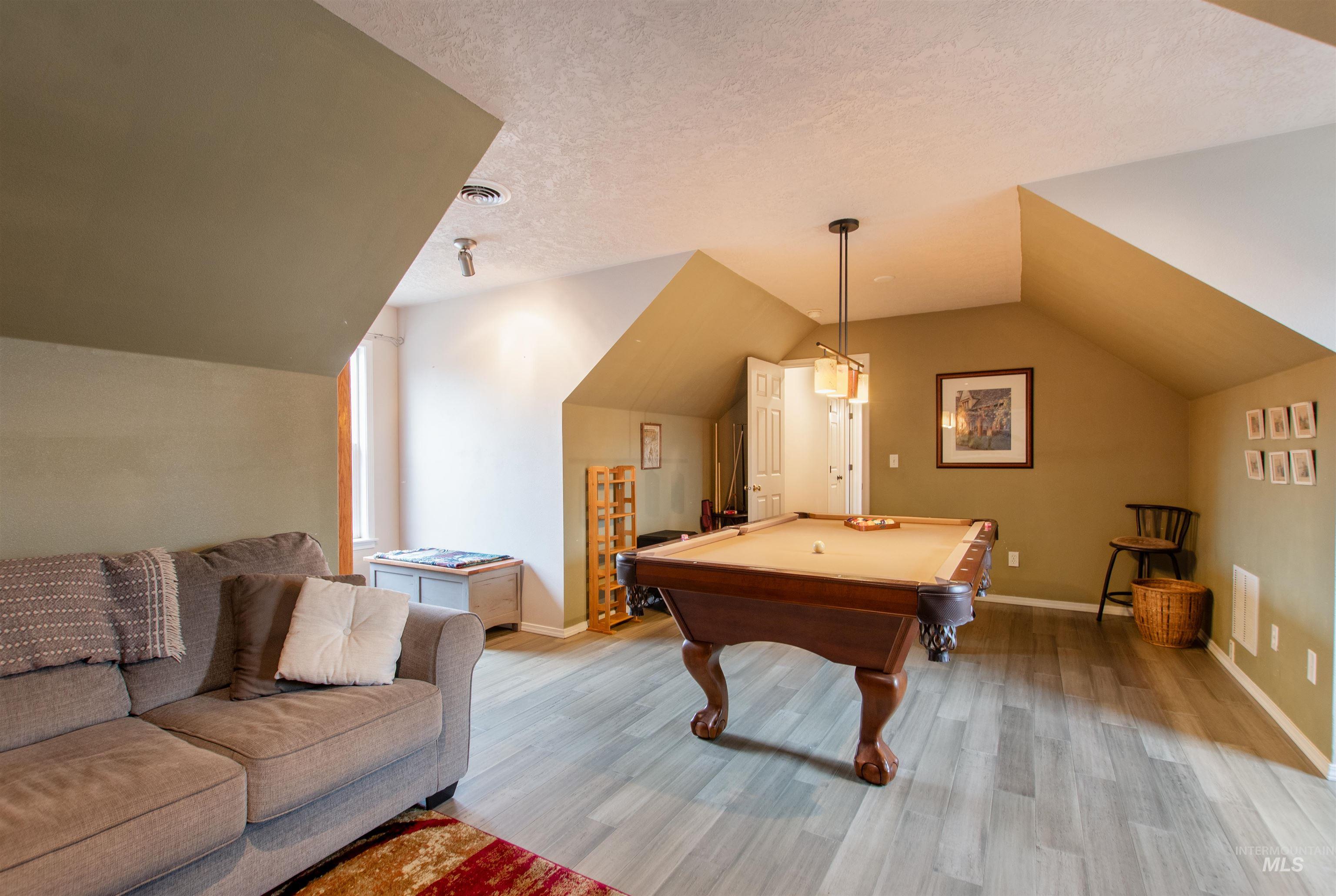 Rec room featuring billiards and light wood-type flooring