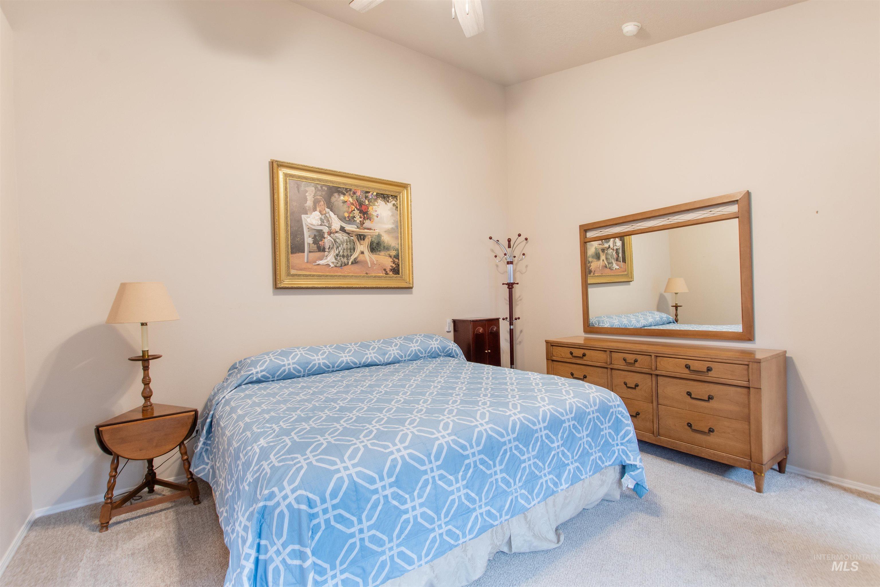Bedroom featuring carpet floors and a ceiling fan