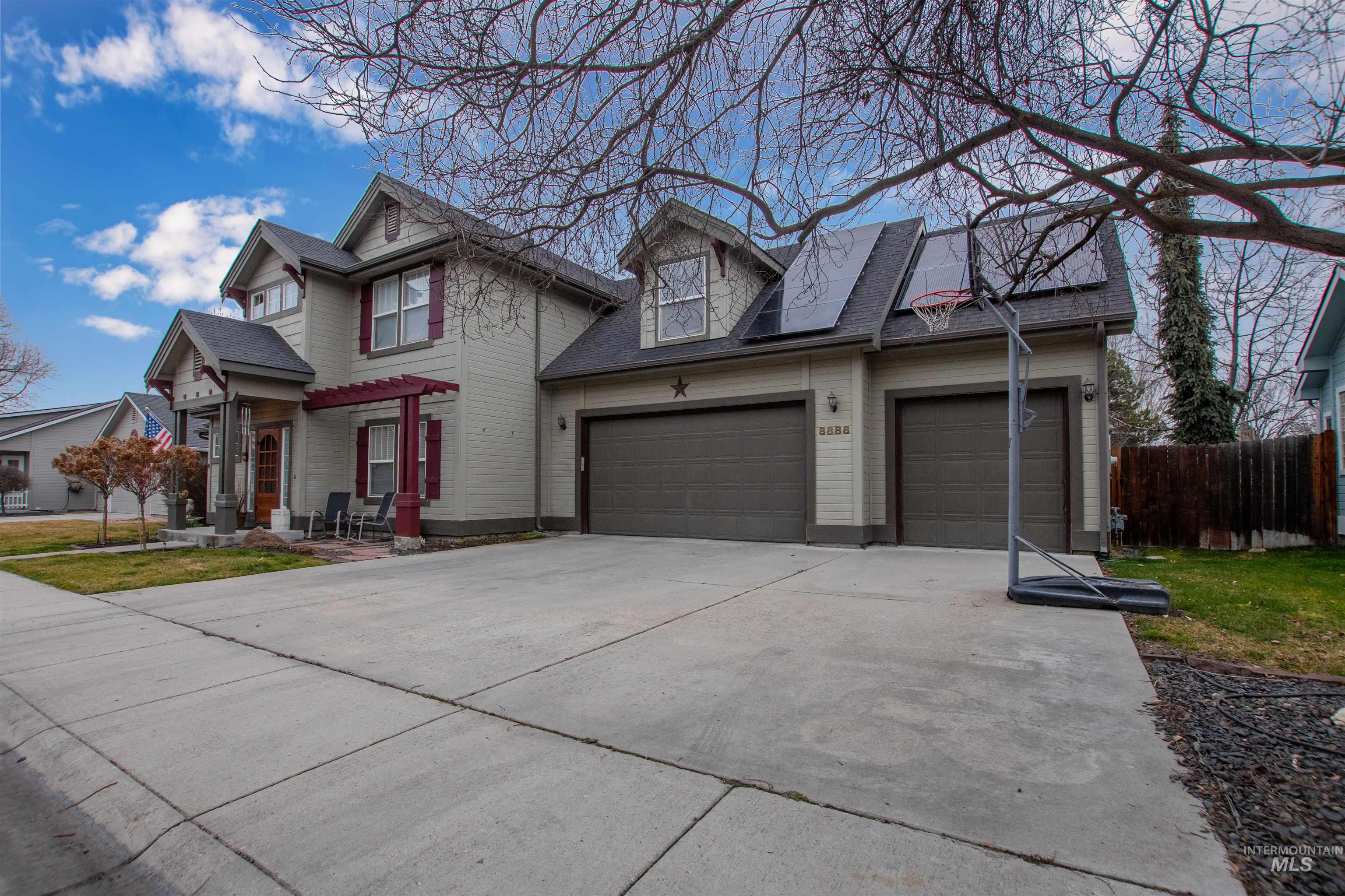 View of front of house featuring driveway and an attached garage
