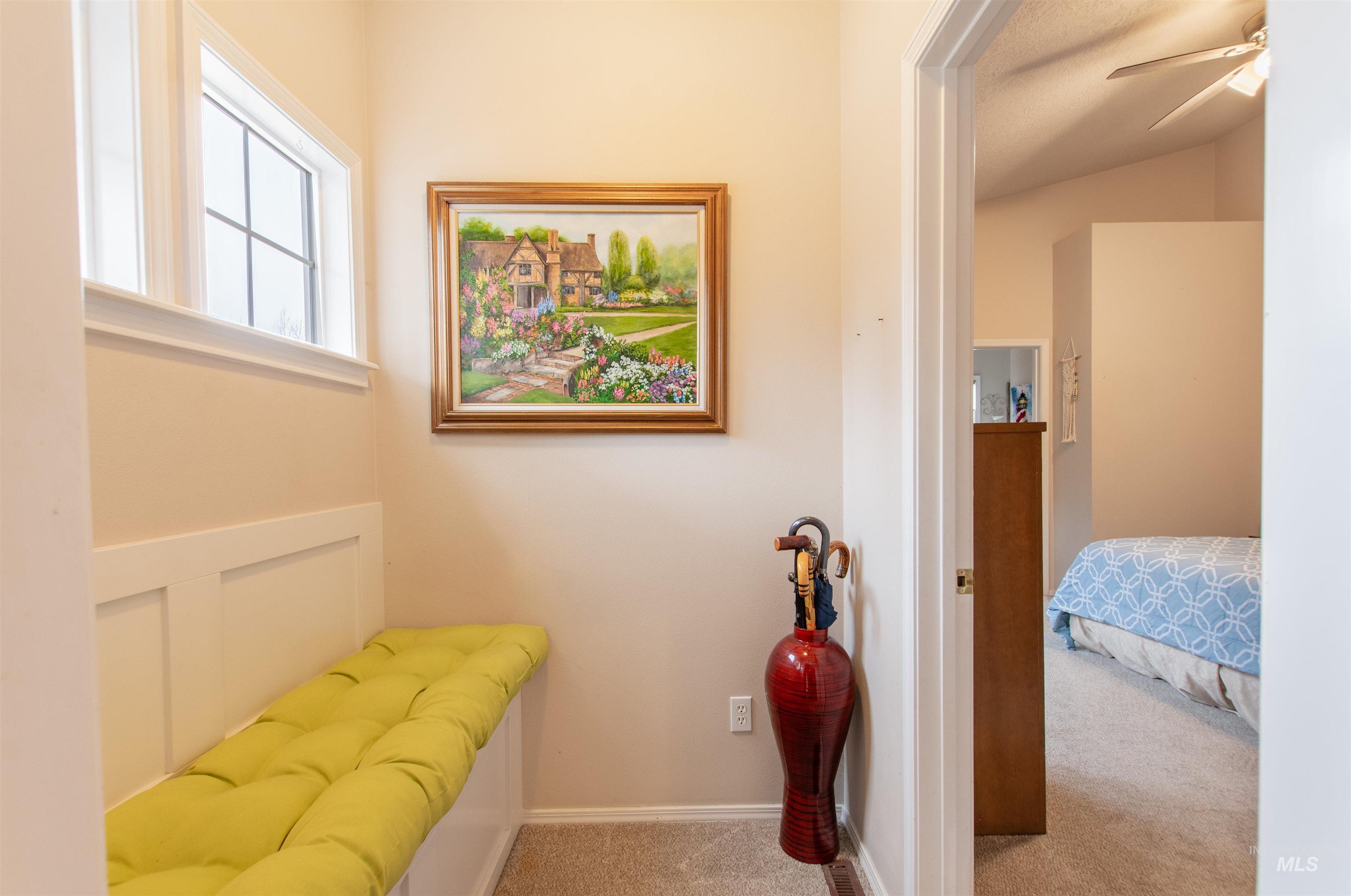 Hall featuring carpet flooring
