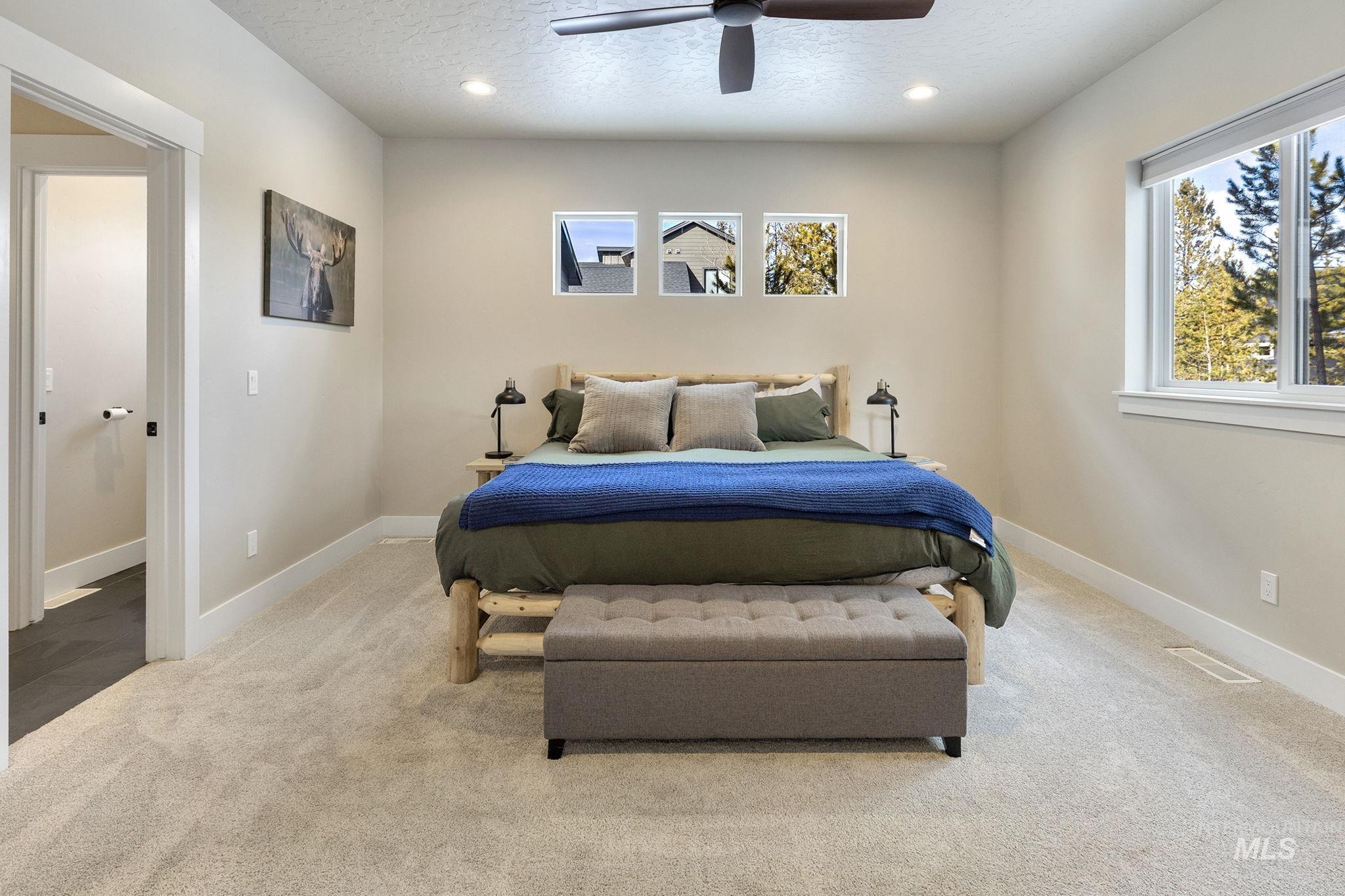 Bedroom with carpet floors, recessed lighting, a ceiling fan, and a textured ceiling
