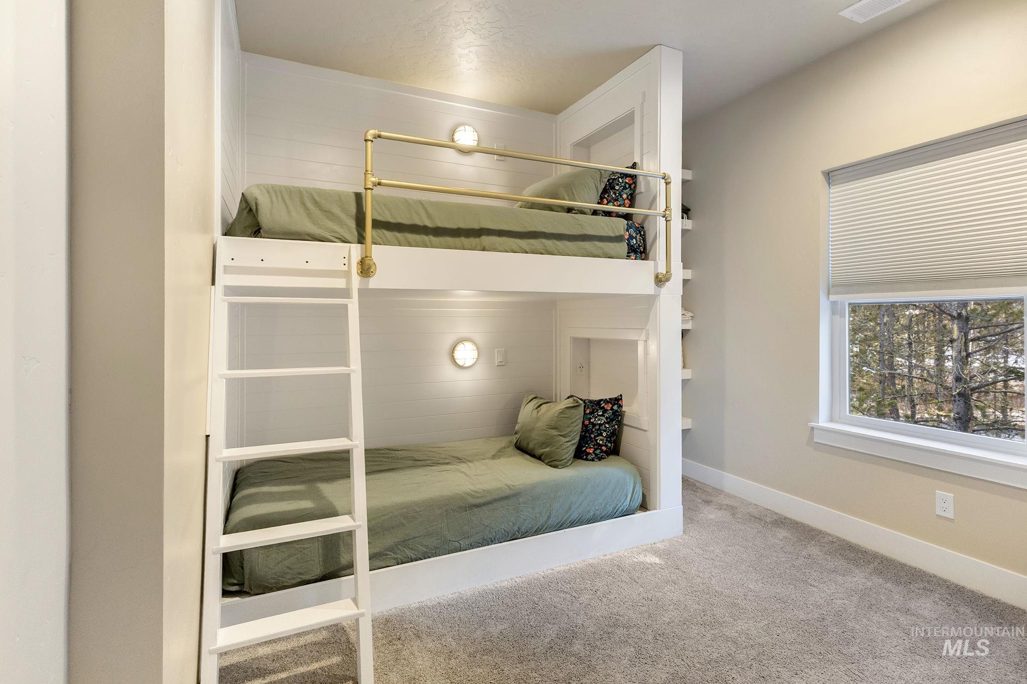 Bedroom with carpet floors and baseboards