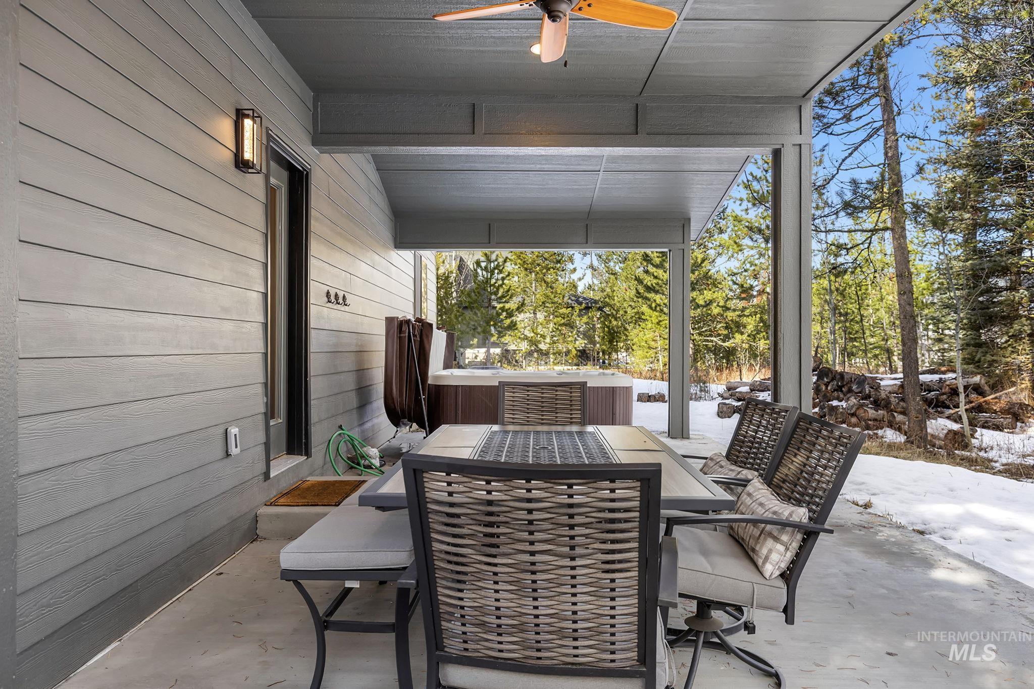View of patio / terrace with outdoor dining area and ceiling fan
