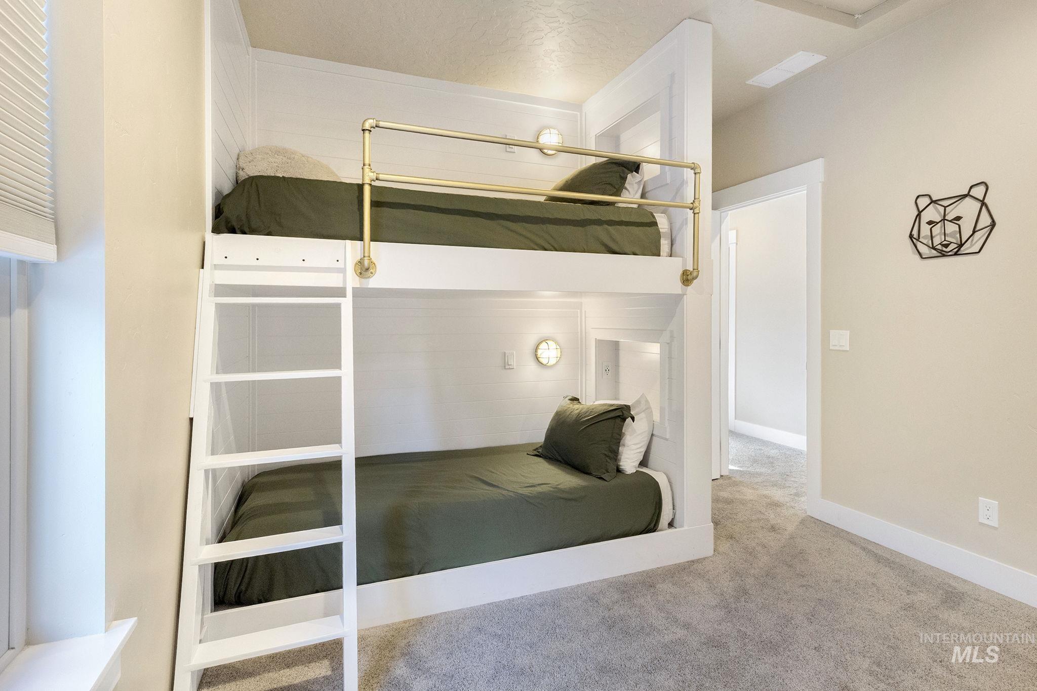 Bedroom with carpet floors and baseboards