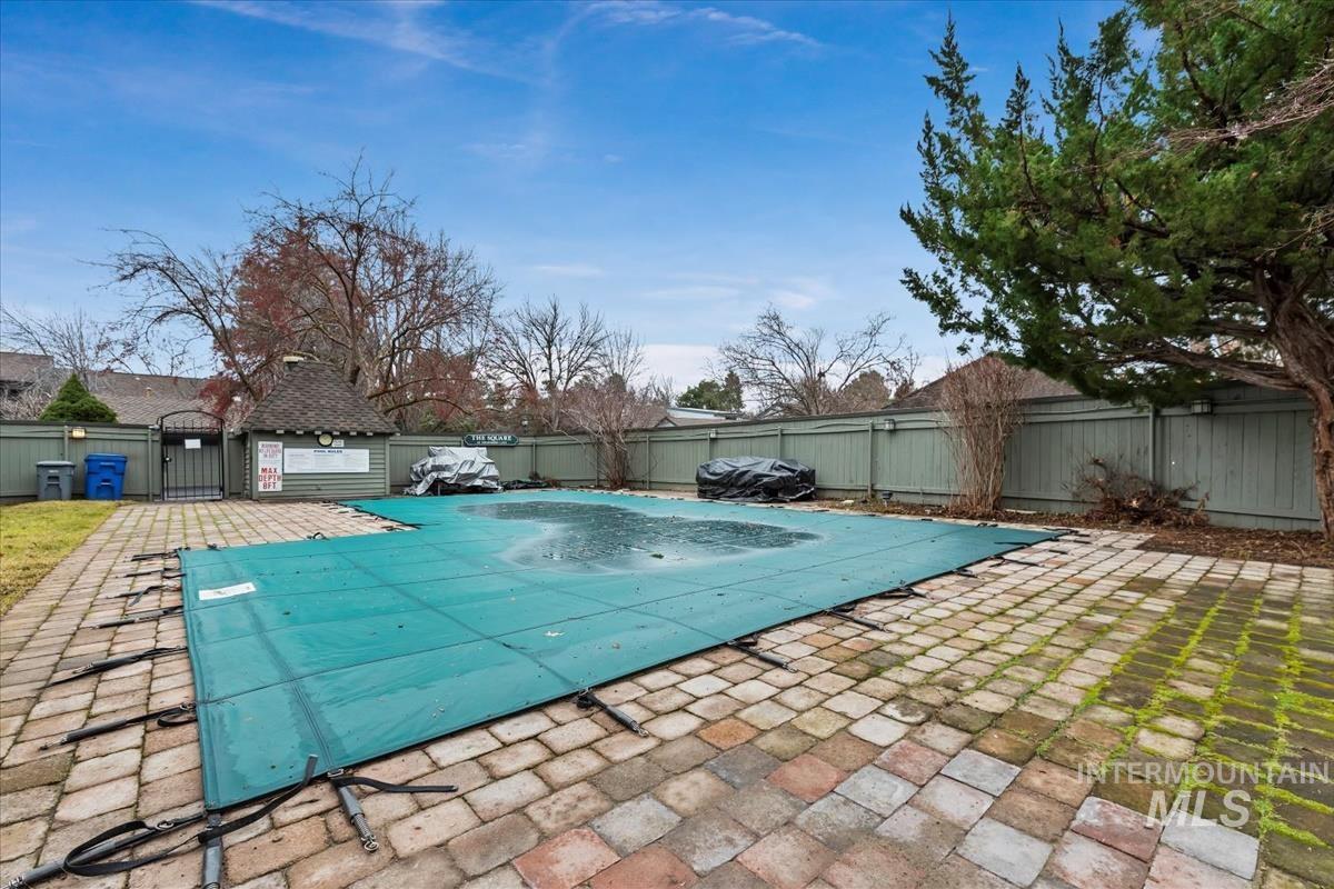 View of pool featuring a fenced backyard and a patio