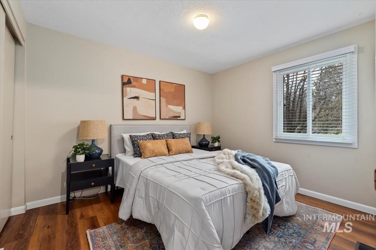 Bedroom with dark wood finished floors