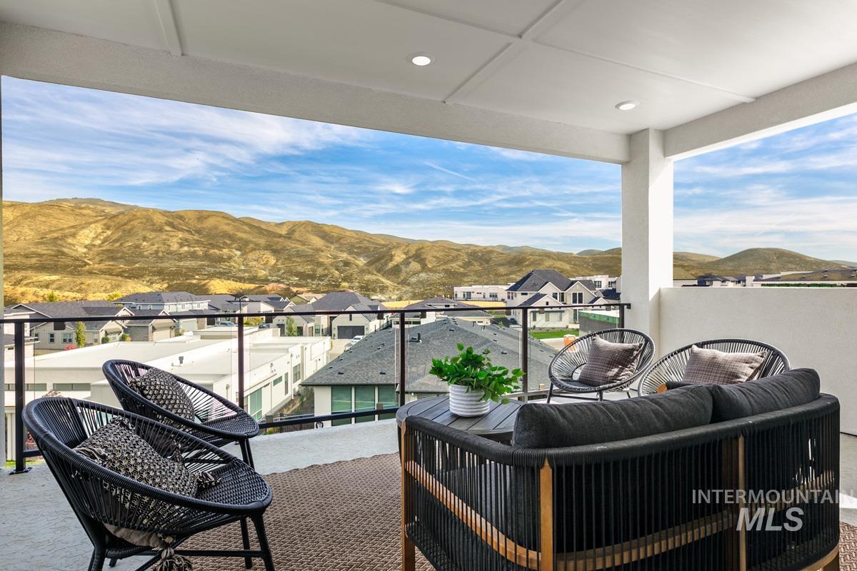 Balcony with a mountain view and a residential view