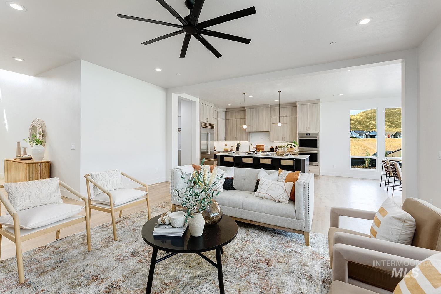 Living area featuring recessed lighting, light wood-type flooring, and ceiling fan