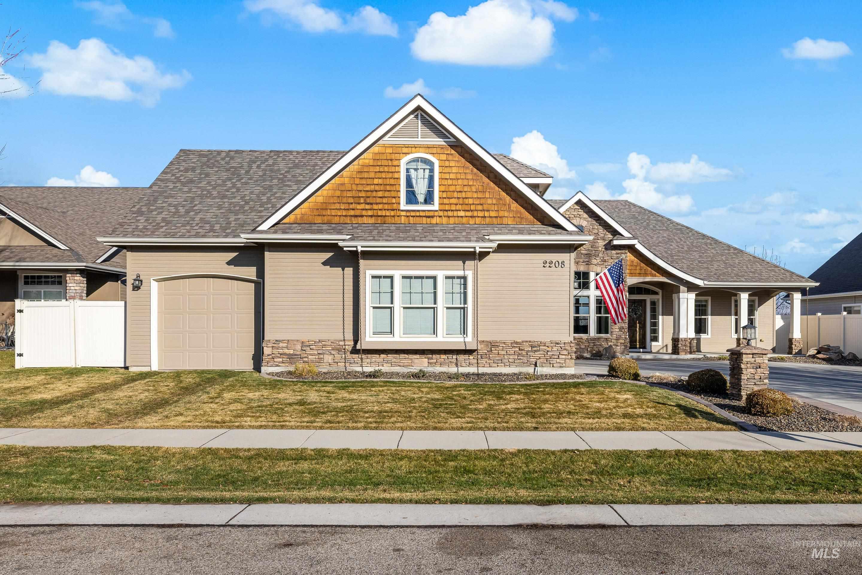 Craftsman house featuring stone siding, a porch, an attached garage, and a shingled roof