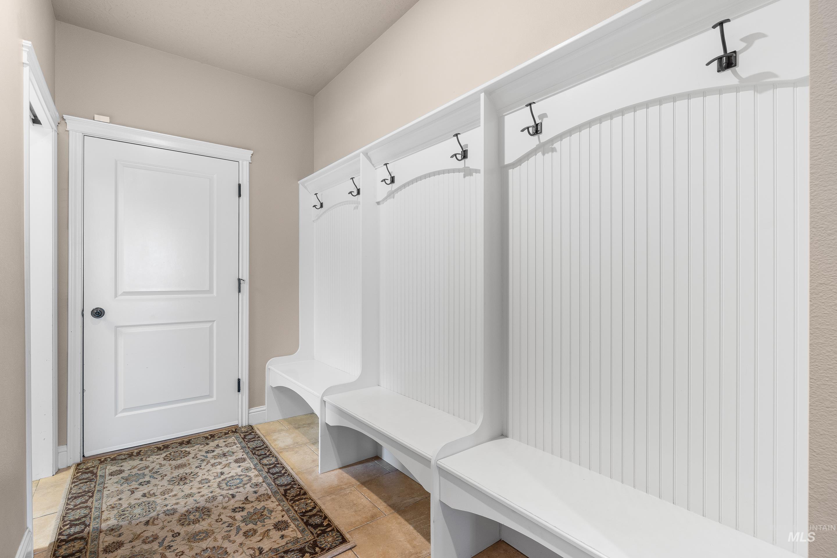 Mudroom featuring tile patterned flooring