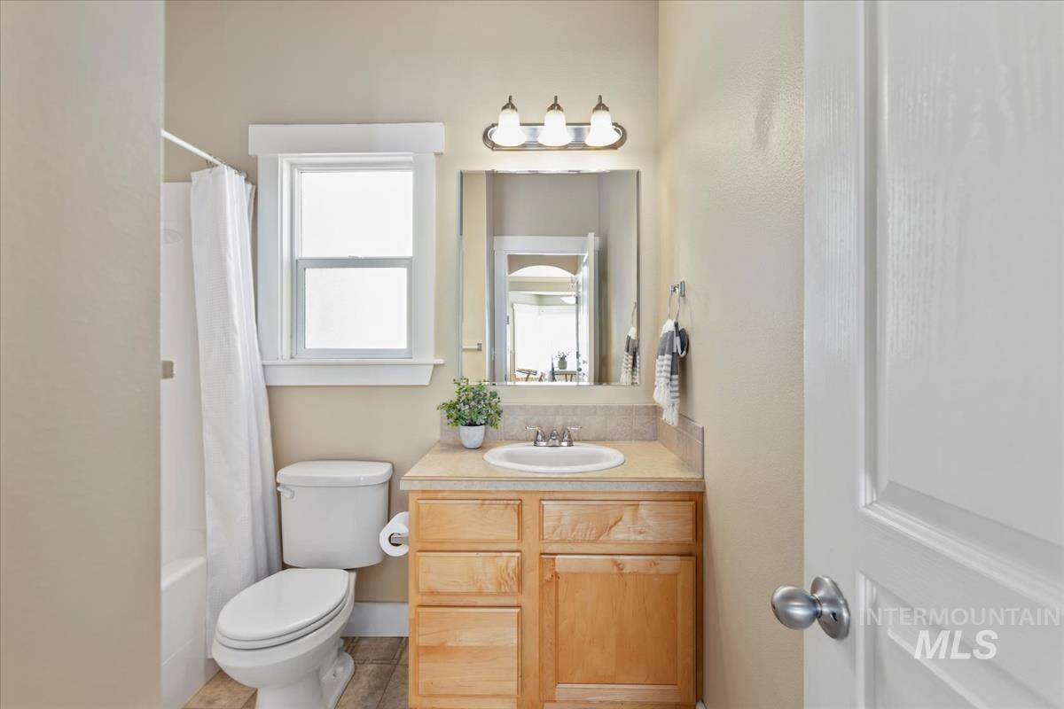 Bathroom featuring vanity and shower / tub combo